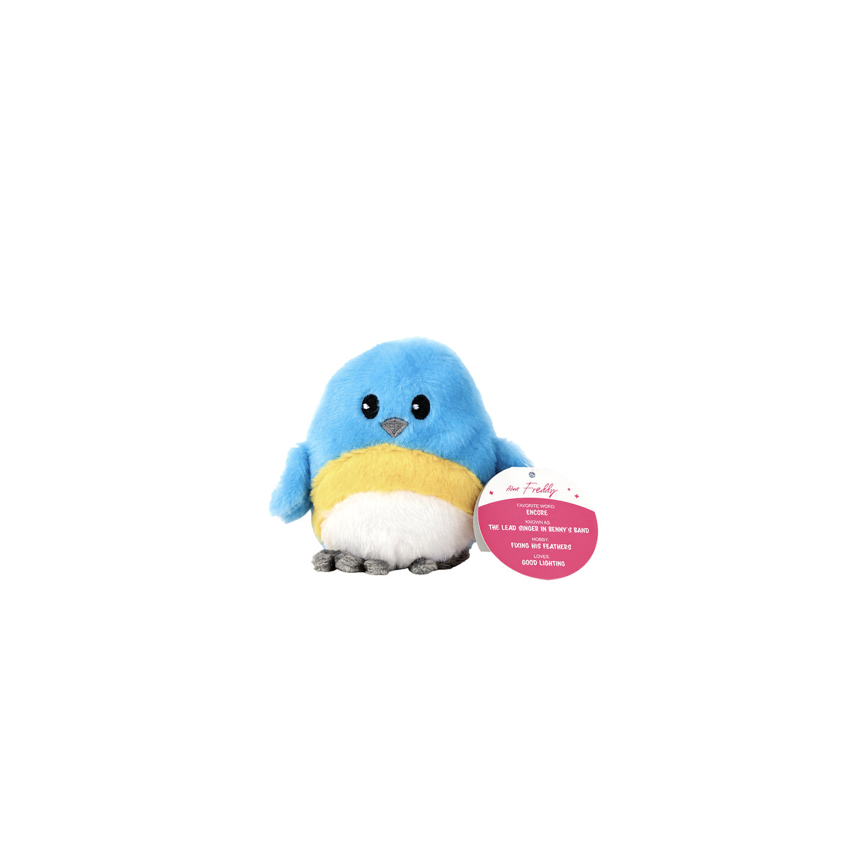 A plush blue Sugar Skwisheez April Showers bird with a yellow chest and white belly, holding a pink circular tag with information about a character named Freddy.