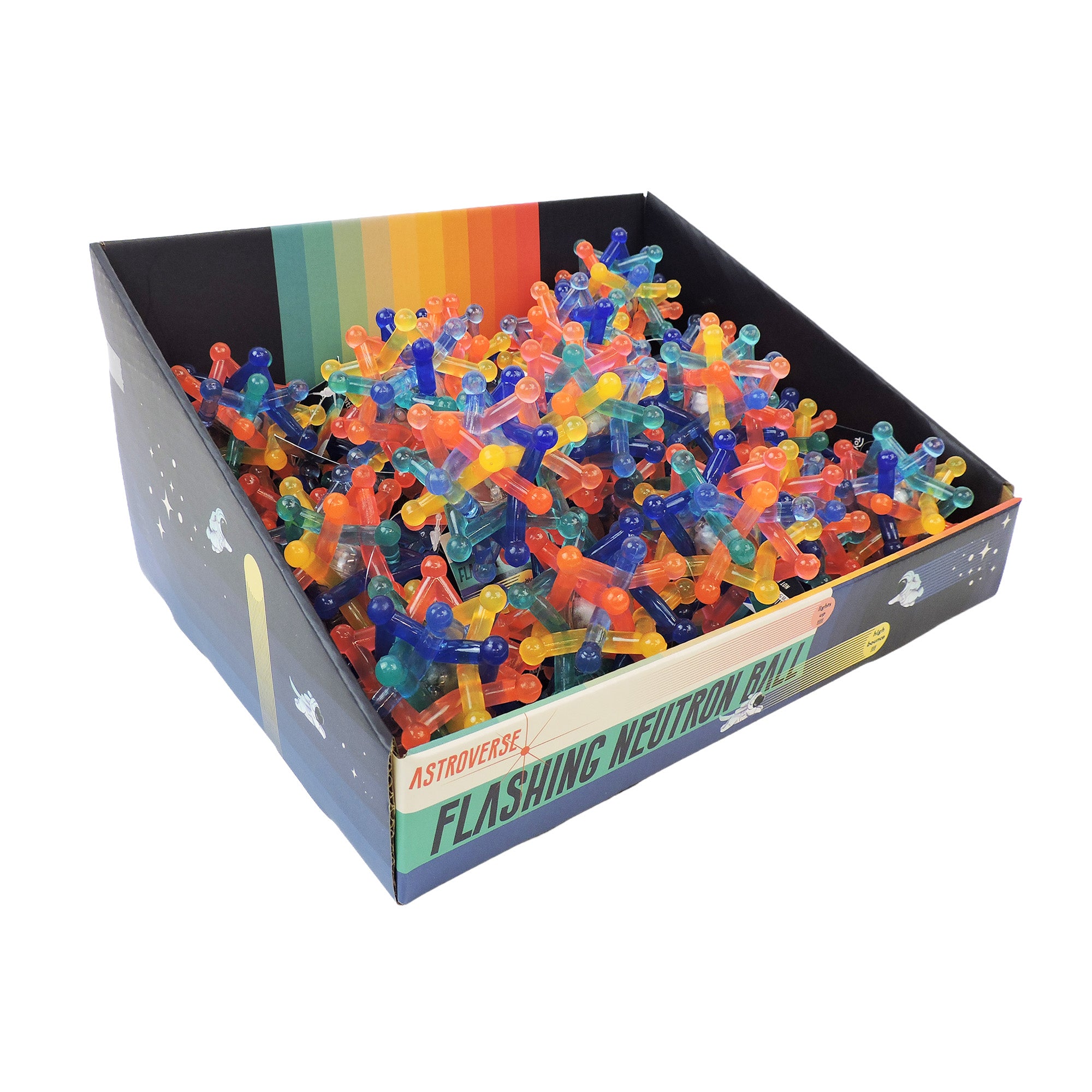 An Astroverse display box labeled "Astroverse Flashing Neutron Ball" holds colorful, spiky sensory balls resembling atomic models in red, blue, green, orange, and yellow, all set against a space-themed background.
