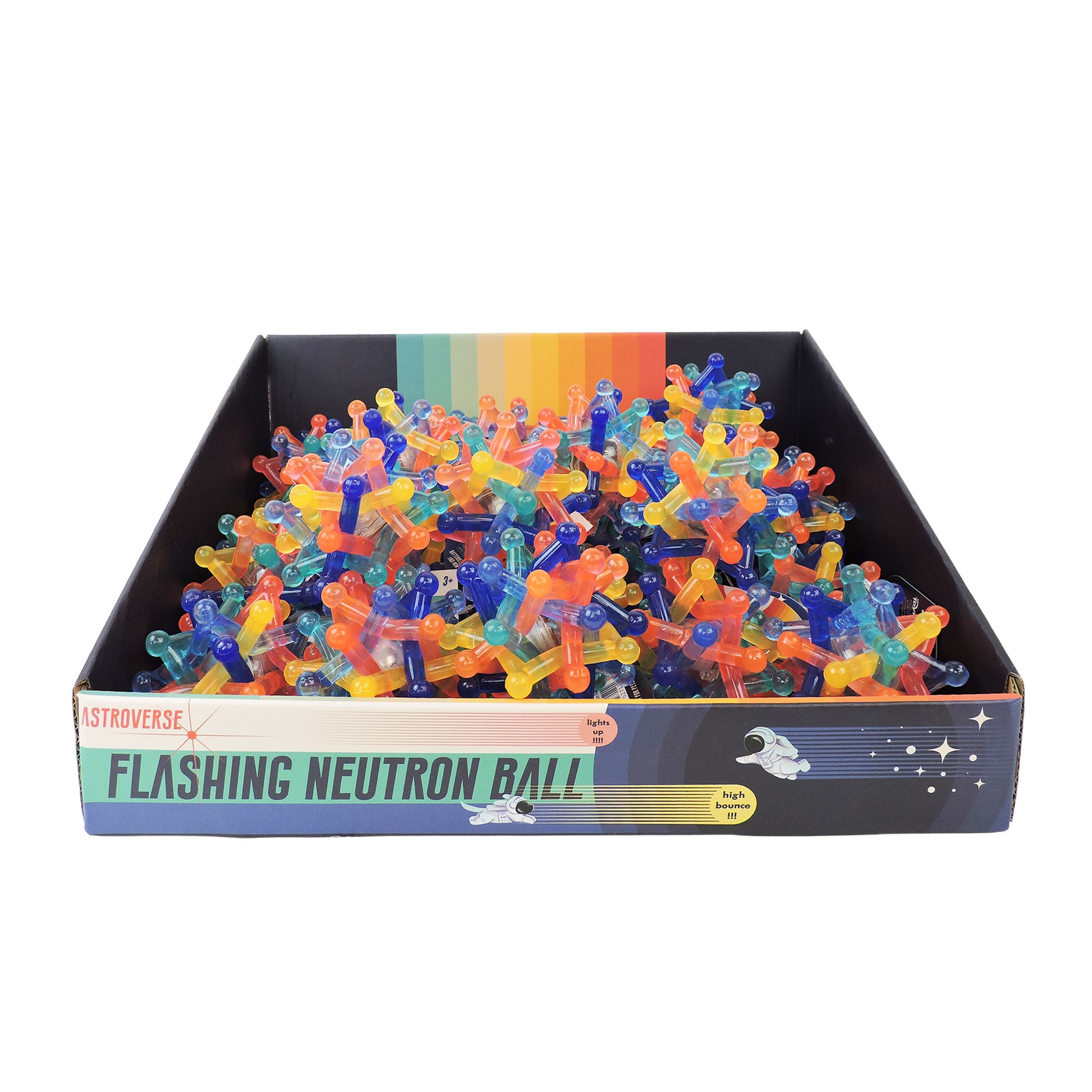 The Astroverse Flashing Neutron Ball by Astroverse is a box of colorful, spiky, light-up bouncy balls in translucent shades. The packaging has a rainbow and space theme with stars and rockets, making it a fun sensory toy.
