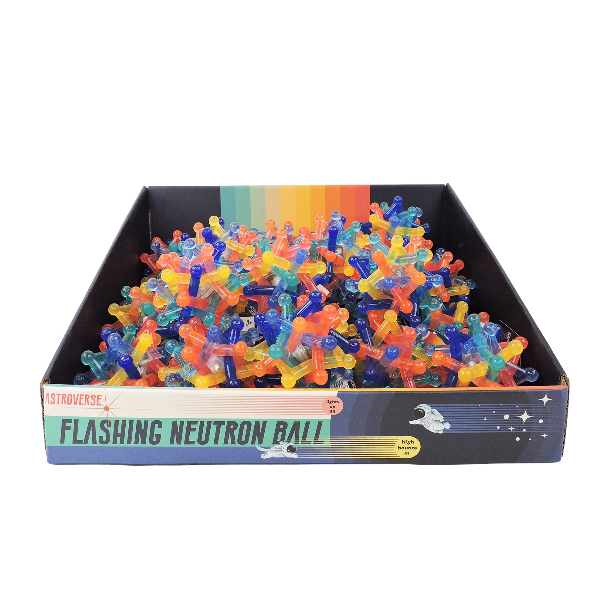 The Astroverse Flashing Neutron Ball by Astroverse is a box of colorful, spiky, light-up bouncy balls in translucent shades. The packaging has a rainbow and space theme with stars and rockets, making it a fun sensory toy.