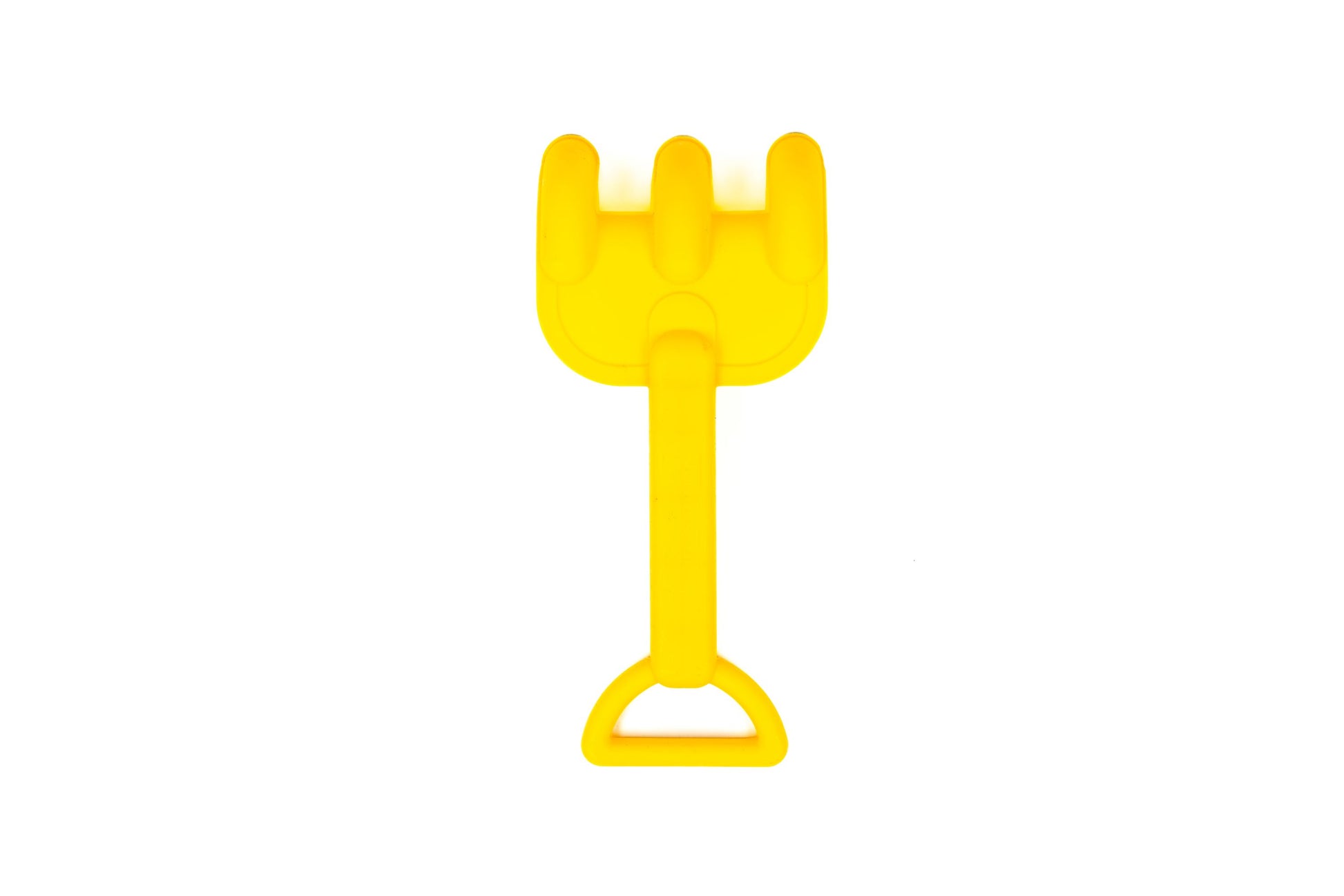 The image shows a small yellow plastic rake with three prongs and handle, part of the Toysmith 6pc Set Pink Sand Bucket Set by Toysmith, commonly used by children for playing in sand. White background.