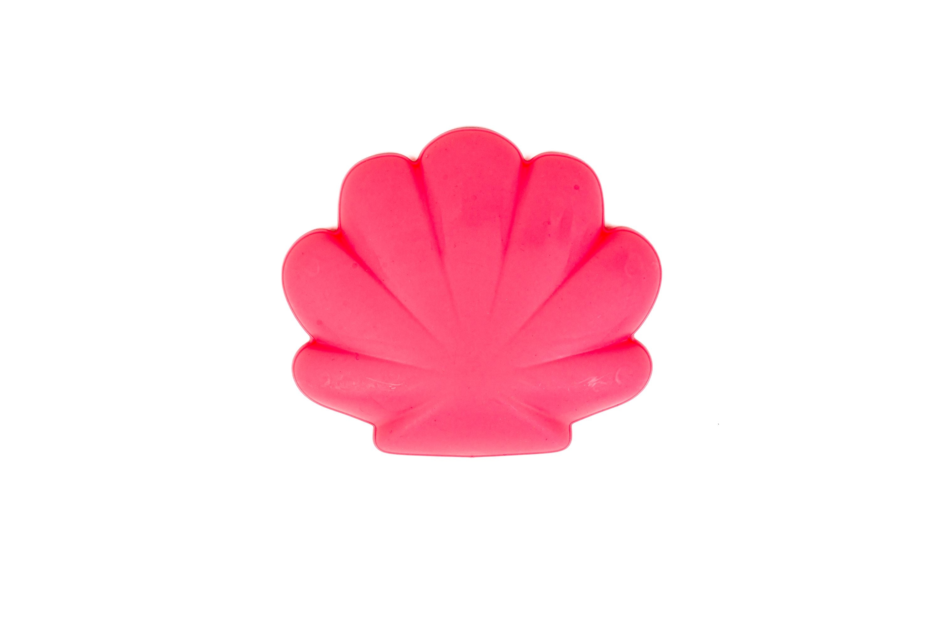 A Toysmith 6pc Set Pink Sand Bucket, shaped like a seashell and ideal for the beach, is centered on a plain white background.