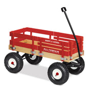 The Radio Flyer All Terrain Cargo Wagon features wooden slats, a sturdy black handle, and rugged tires—ideal for carrying items or children on any adventure.