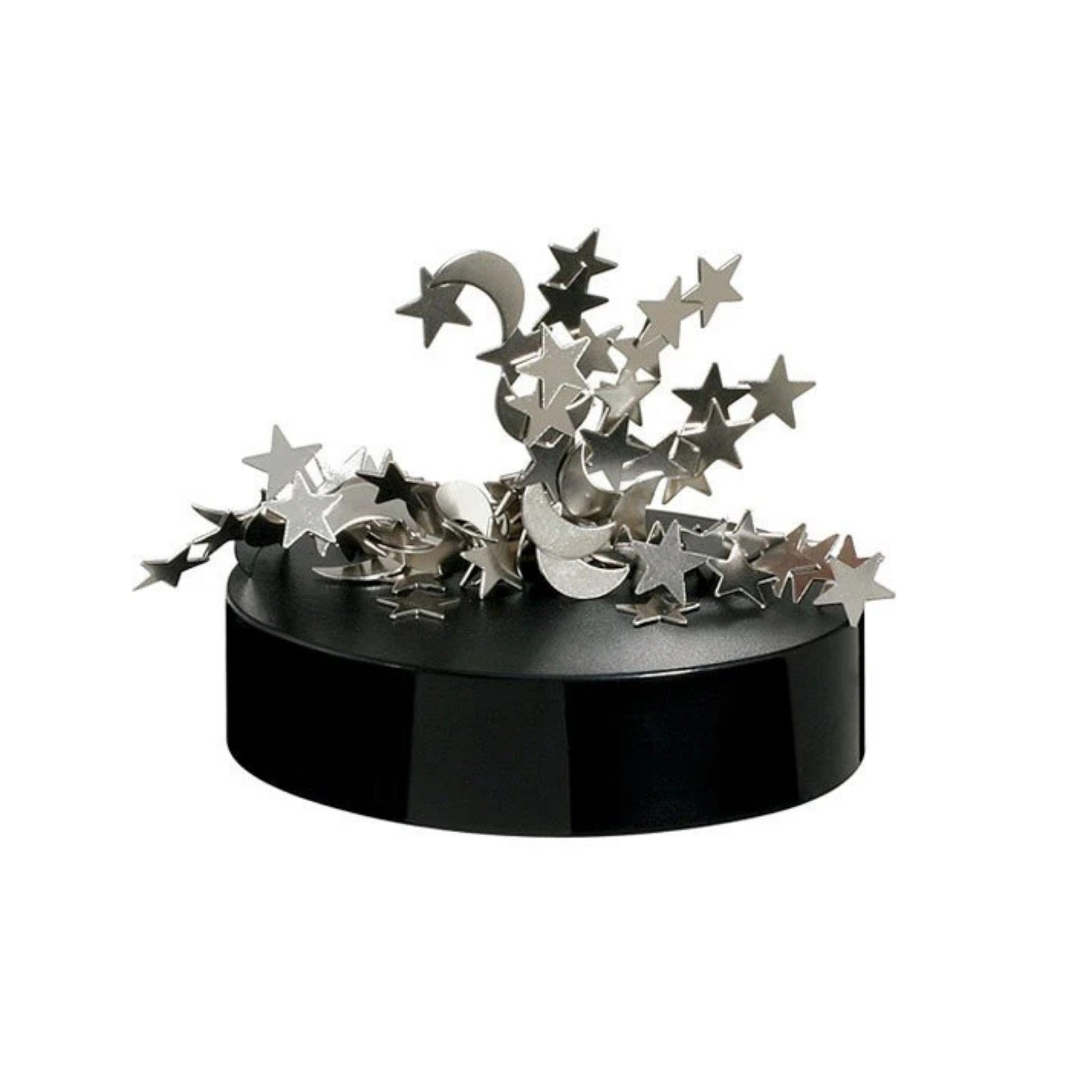 Small silver star and moon shapes are stacked and scattered on a round black base, forming the Project Blueprint Magnetic Sculpture—a whimsical, celestial-themed desk accessory that stands out against a plain white background.