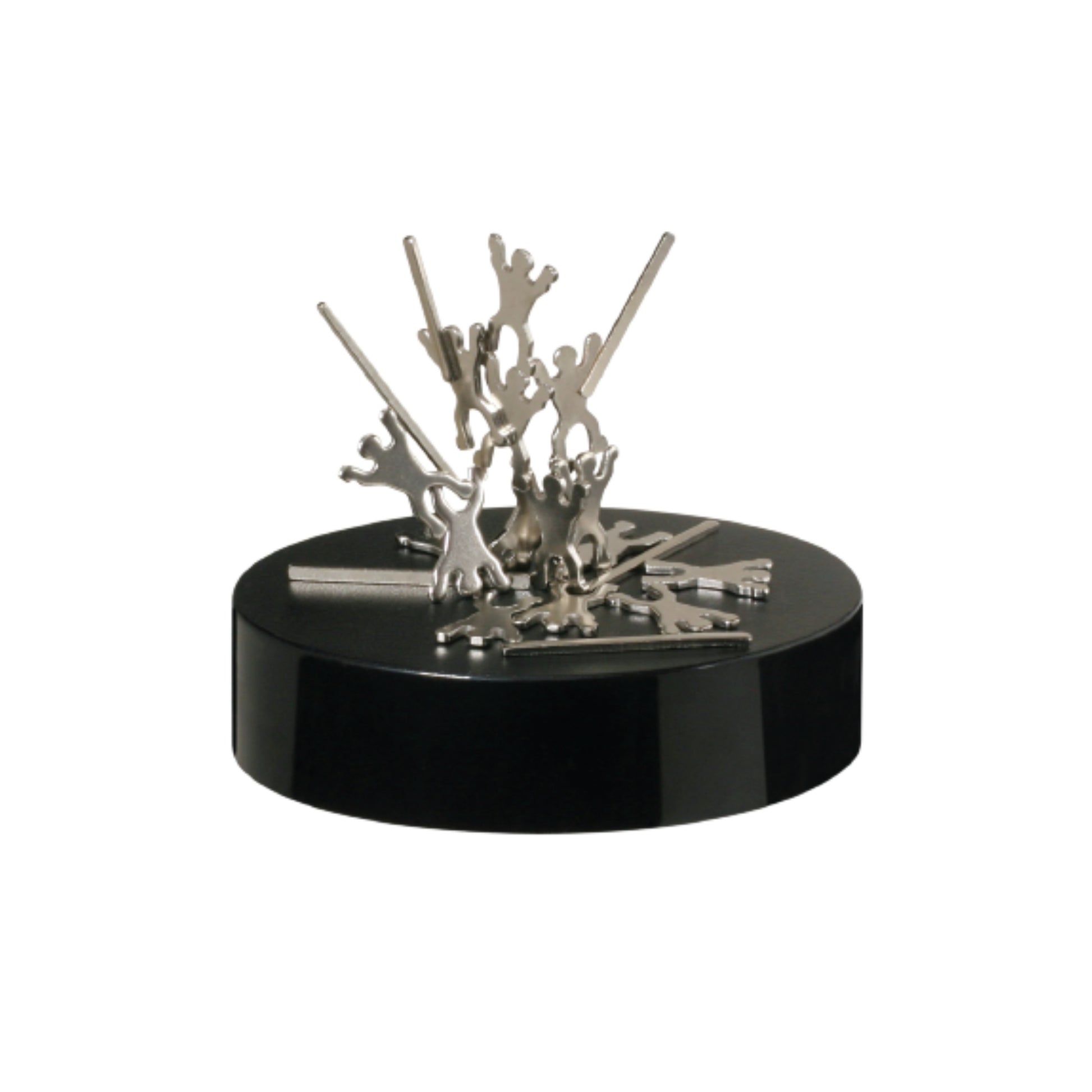 The Project Blueprint Magnetic Sculpture features metallic key-shaped pieces standing on a black circular base, forming an abstract, magnetic desk accessory that adds a unique touch to any workspace.