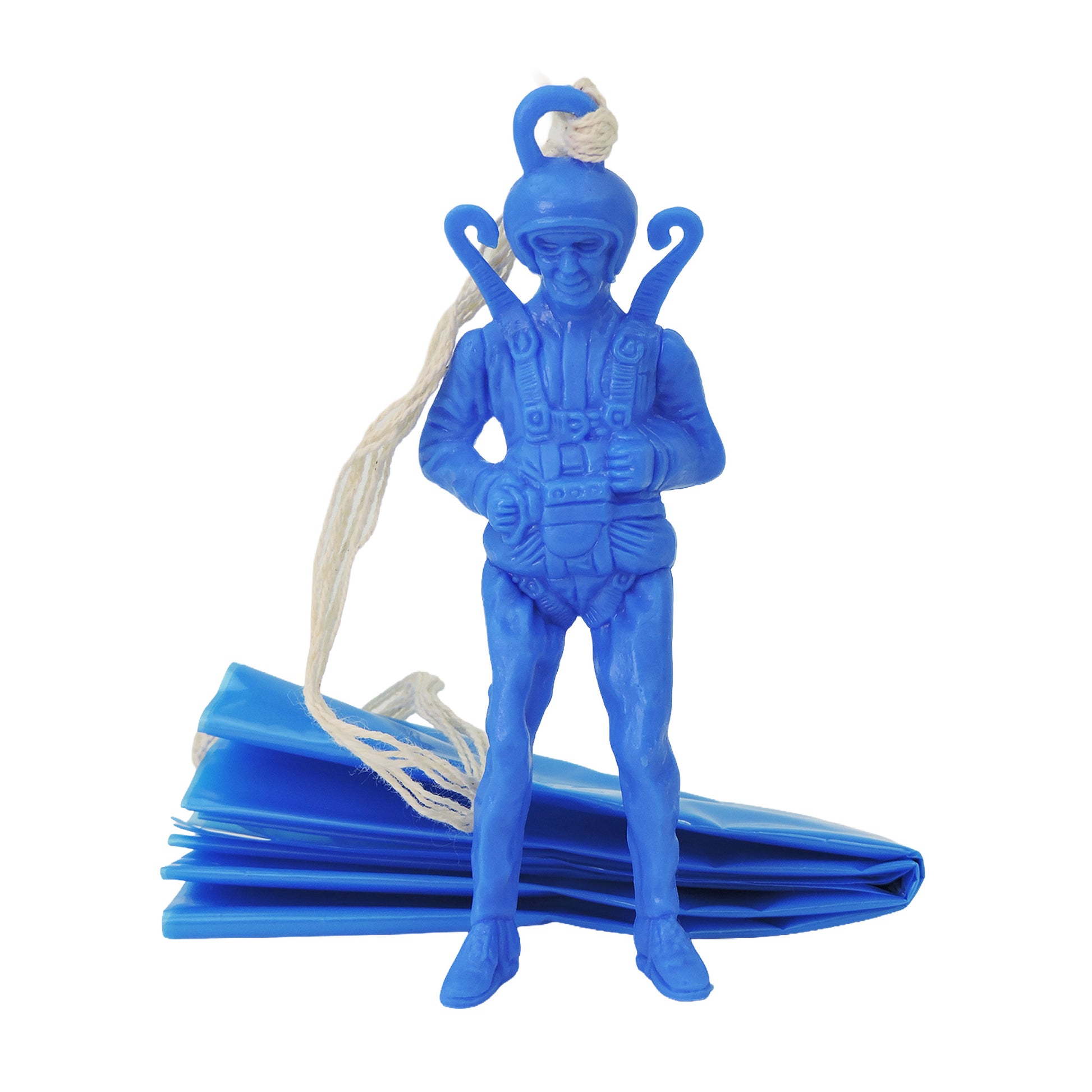The Toysmith Giant Parachuter Figure by Toysmith is a blue plastic toy with a helmet and harness, standing upright and attached to a folded blue parachute with white string.