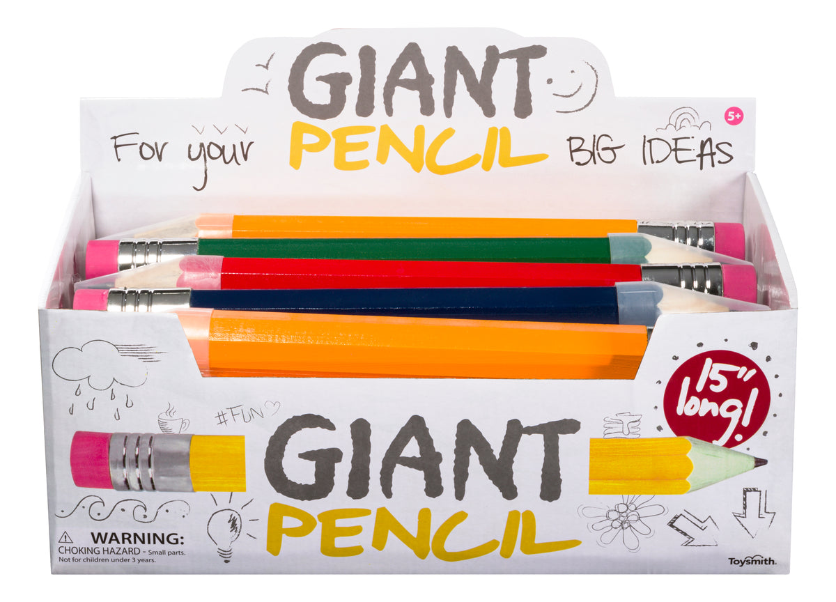 A Toysmith display box labeled "Giant Pencil" contains colorful, oversized novelty pencils. The box features playful text: “15” long!” and “For your big ideas.” Product: Toysmith Giant Pencil. Brand: Toysmith.