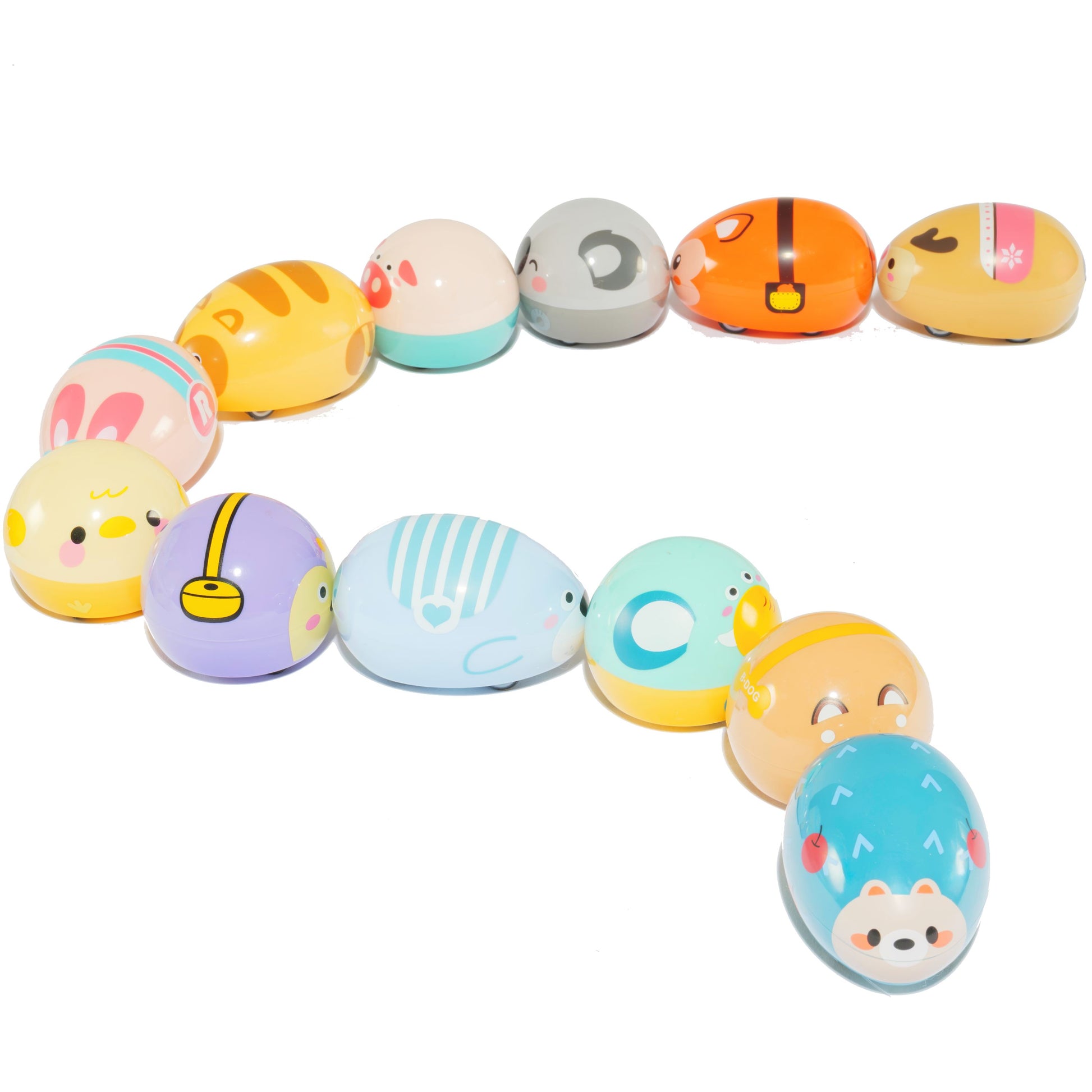 Twelve colorful Farm Fresh Zippy Critters Magnetic Pull-Back Toys, shaped like oval farm animals with cute faces, are arranged in a curved line—perfect for imaginative play on a white background.