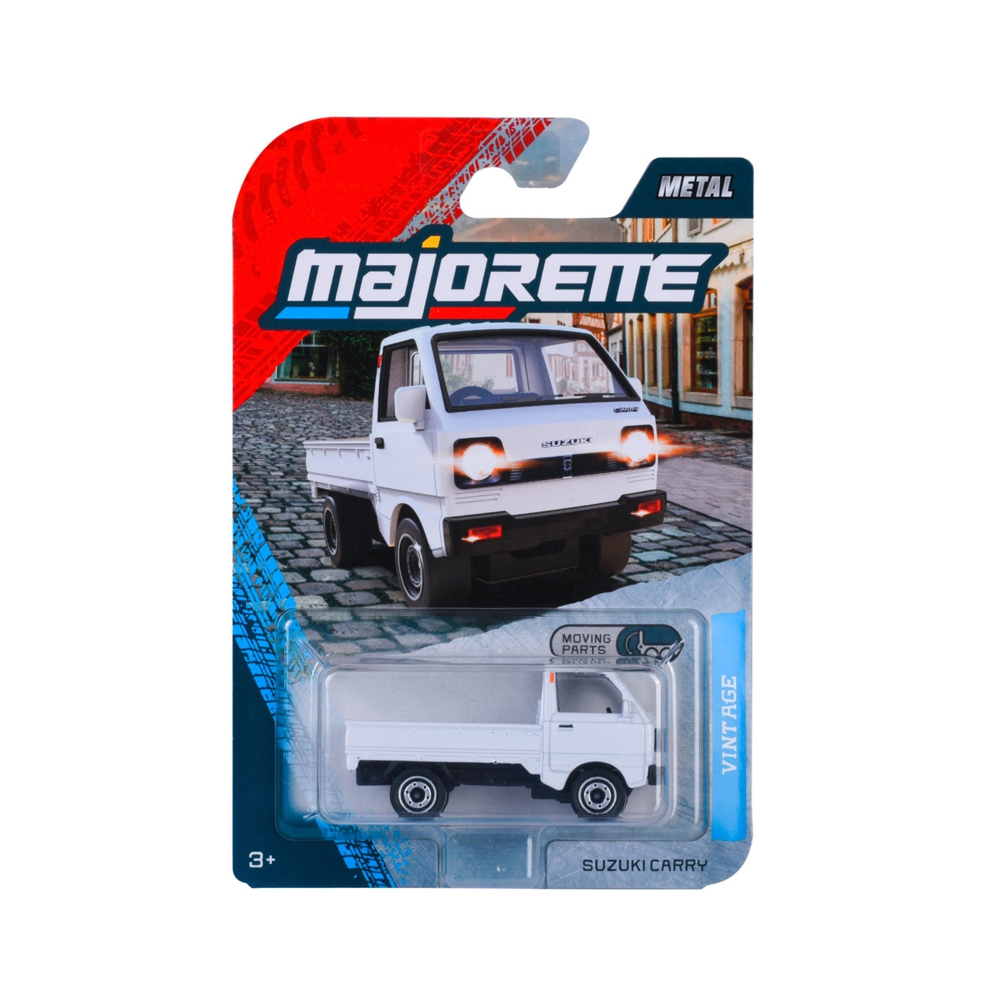 Packaged Majorette Vintage Premium Diecast Car, modeled after a white Suzuki Carry truck, is shown against a cobblestone street background. Packaging features "Vintage" and "Moving Parts." Suitable for ages 3+.