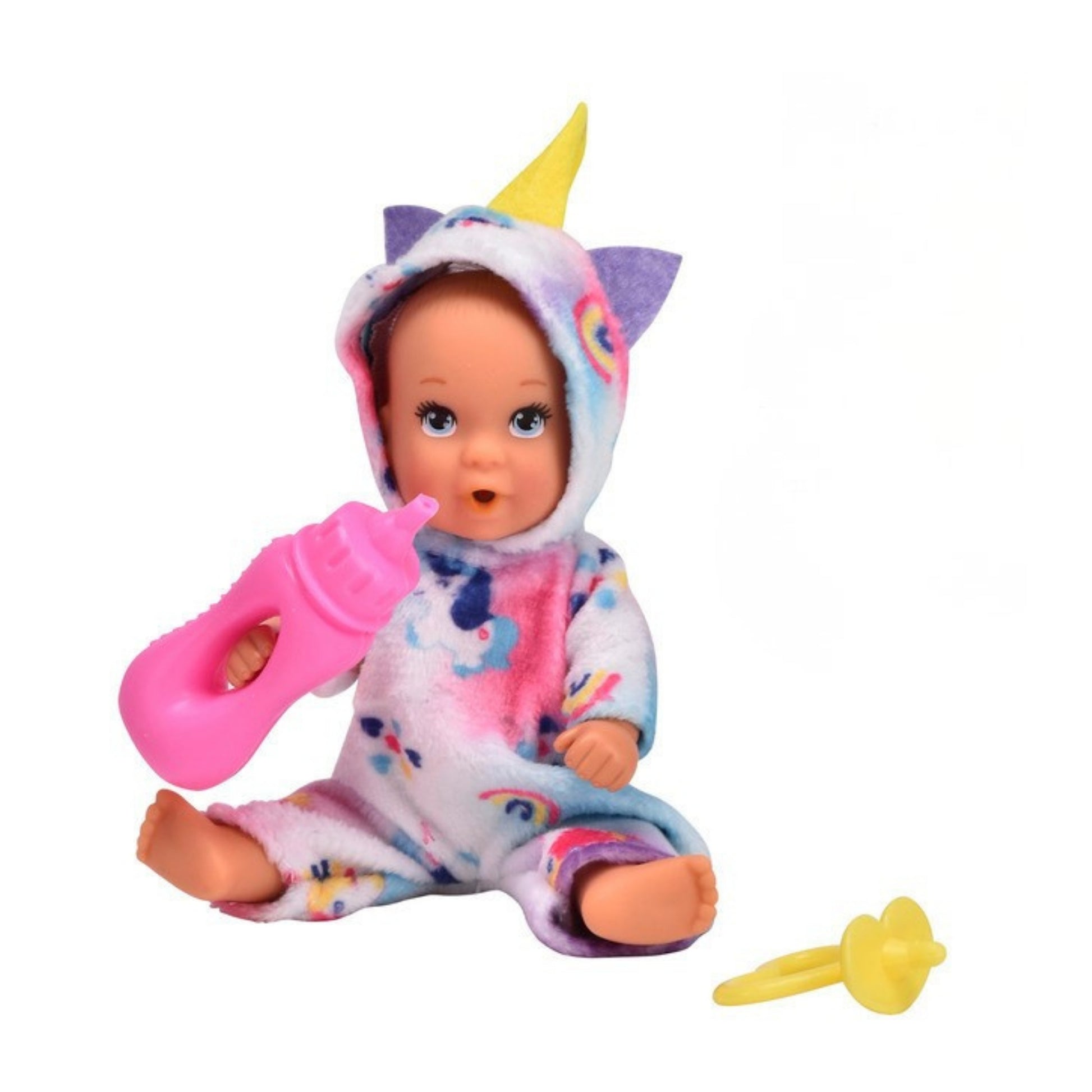 The Simba Onesie Baby Doll wears a colorful unicorn onesie with a yellow horn and ears, holds a pink baby bottle, and has a yellow pacifier beside it—all displayed against a plain white background.