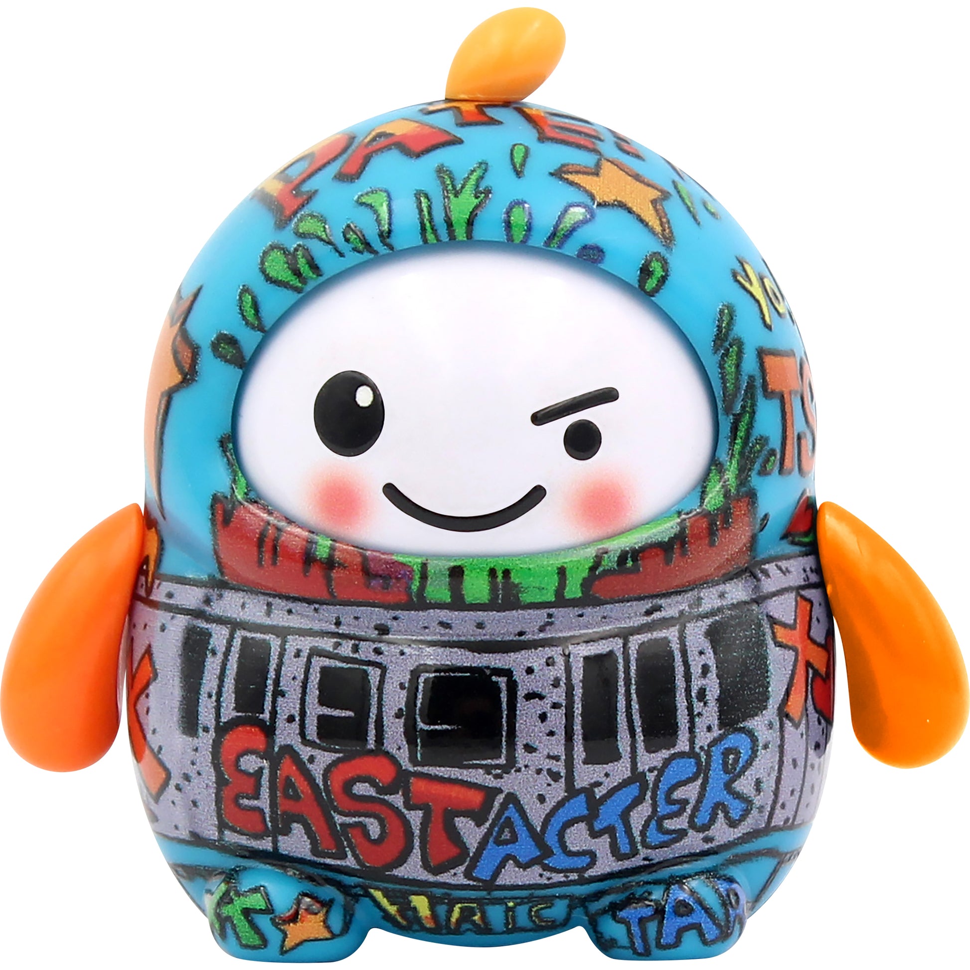 The NSI LamaTama Series 1 features a colorful, round toy with a smiling, winking face, blue and orange accents, orange flipper arms, graffiti-style "EASTACTER" designs, and comes as a collectible in blind packaging.