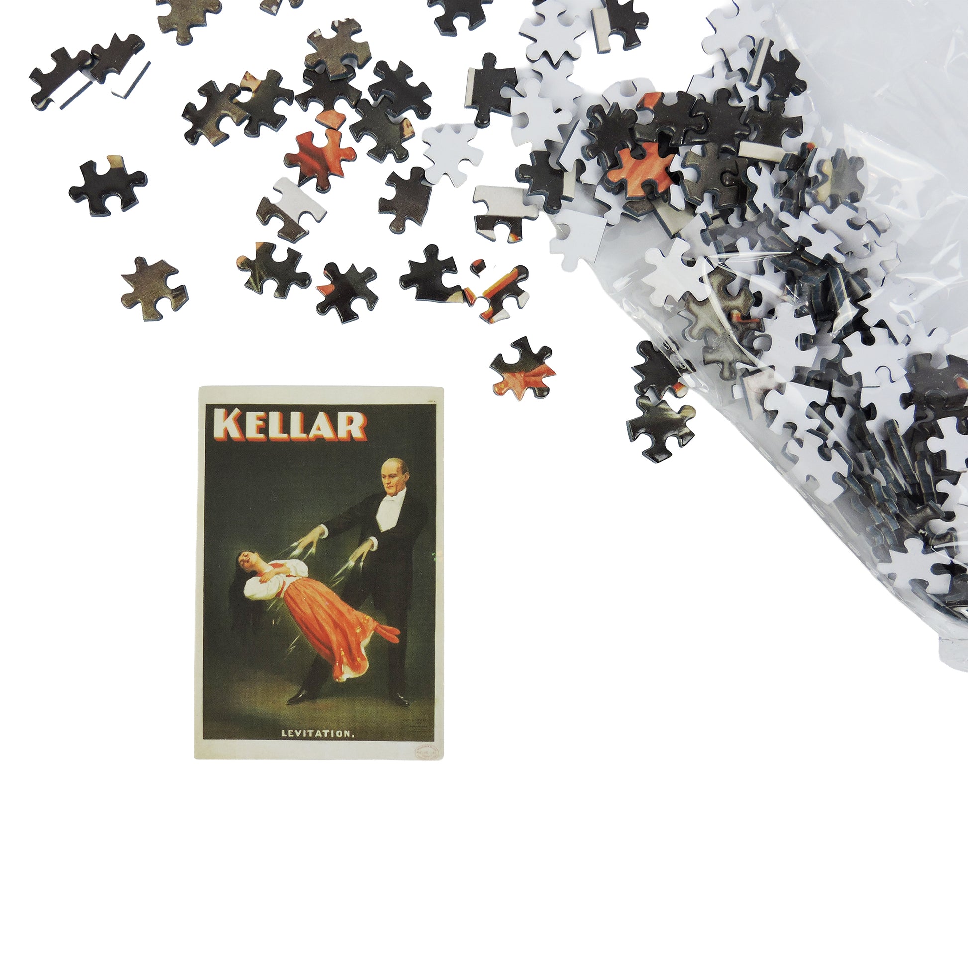 A bag of Tiny Toys Itty Bitty Petite Puzzles is spilled on a white surface beside a puzzle piece showing a vintage magician levitating a woman, with "KELLAR" written above them.