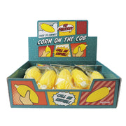 Toysmith Corn on the Cob by Toysmith is a display box of yellow sensory squishy toys, featuring comic-style graphics and phrases like “So Squishy!” and “Call Me Kernel!”—a fun fidget toy perfect for squeezing.