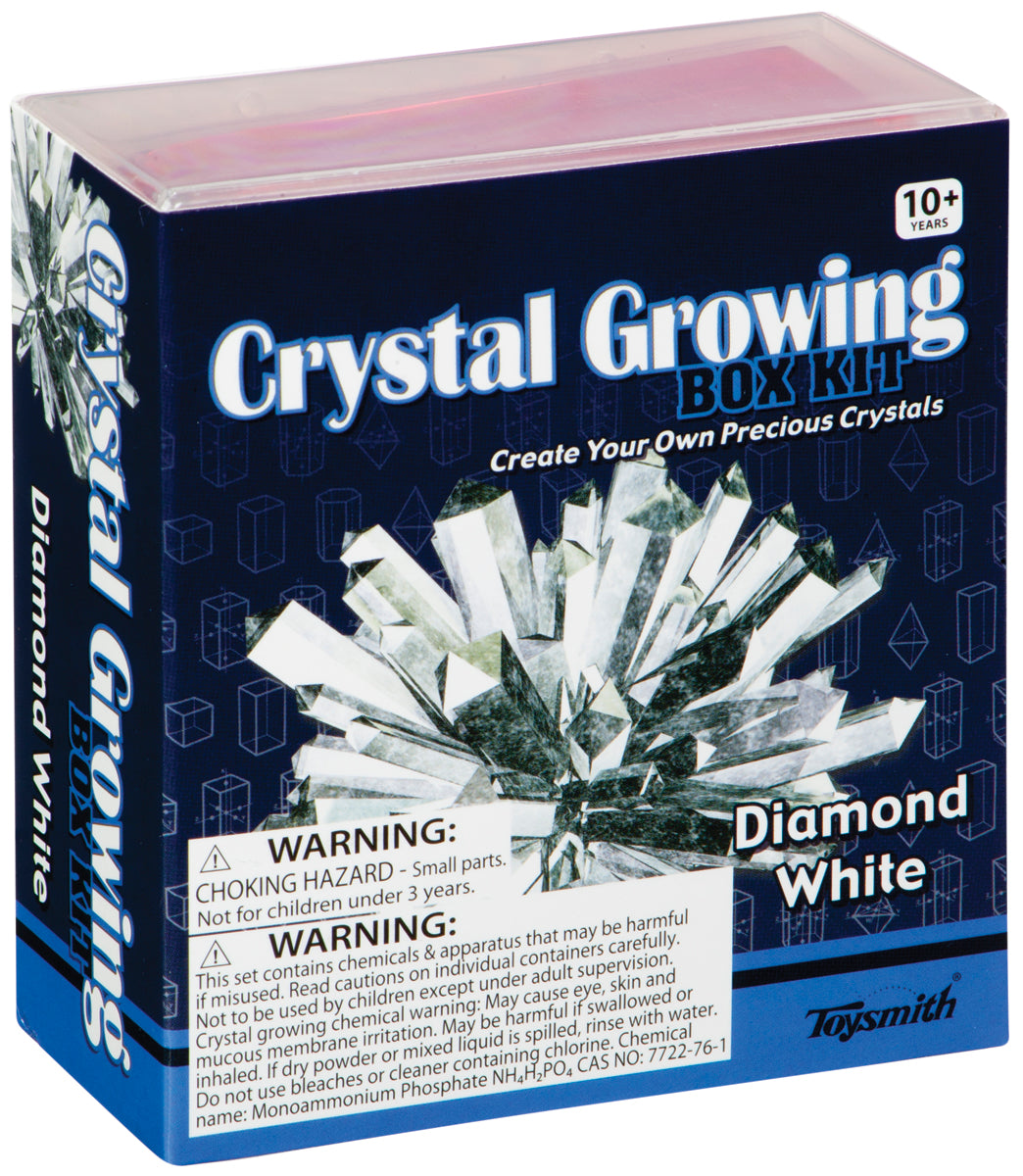 The Toysmith Crystal Growing Kit is a DIY science kit for ages 10+, letting kids grow sparkling white crystals. The box shows crystal images and warns of small parts and chemical hazards. Brand: Toysmith.