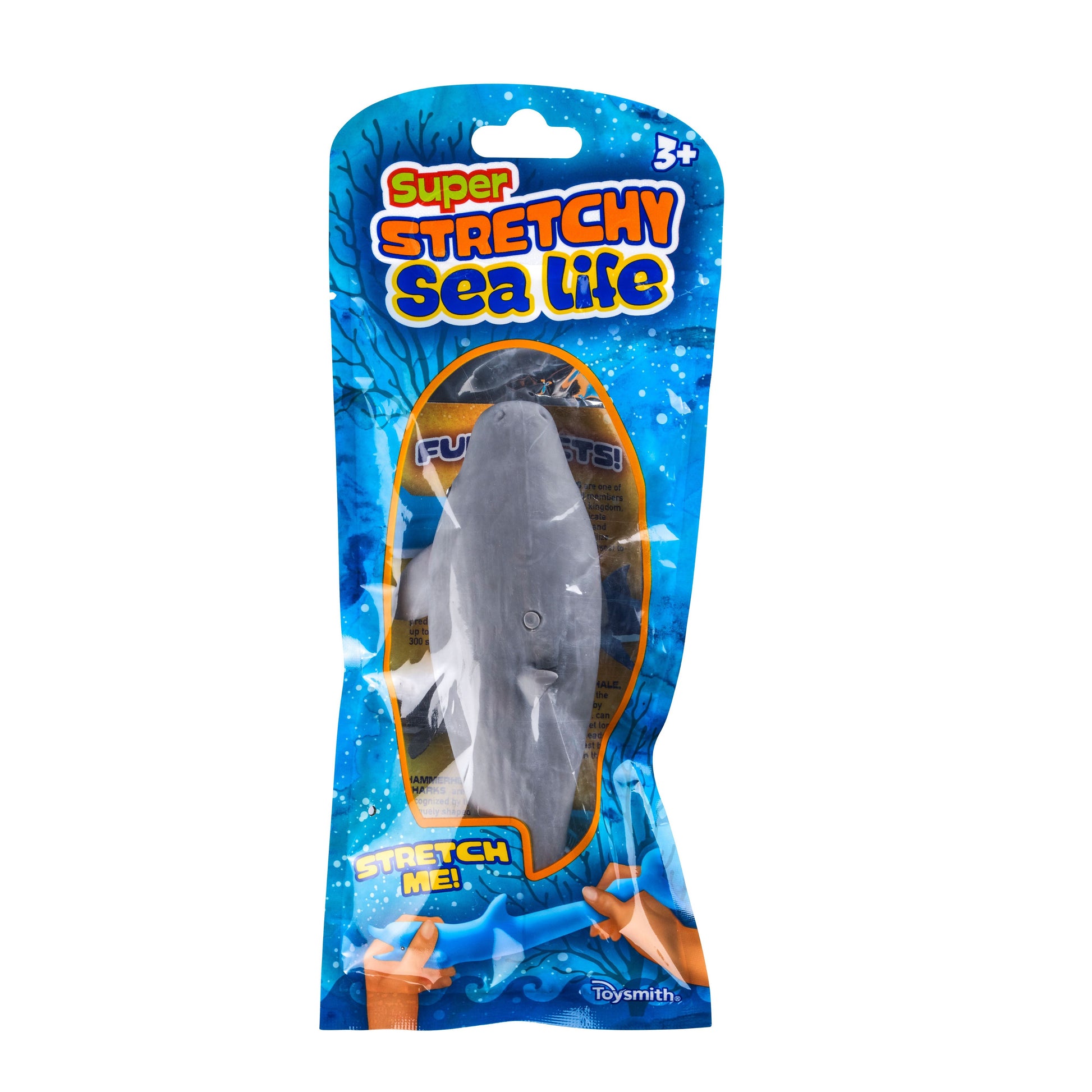 The Toysmith Super Stretchy Sand Filled Sea Life toy, for ages 3+, features a stretchy gray shark in a blue ocean-themed bag labeled “Stretch Me!” and “Fun Gifts!” on the front. Brand: Toysmith.