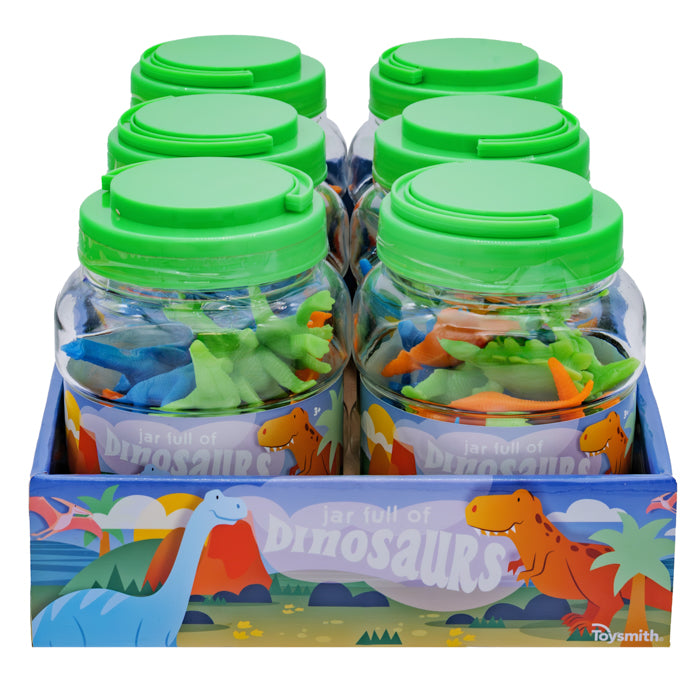 Six Toysmith Jar Full of Dinos by Toysmith—clear jars with green lids, each packed with vibrant dinosaur figures—are displayed in a box featuring playful cartoon dinosaur art.