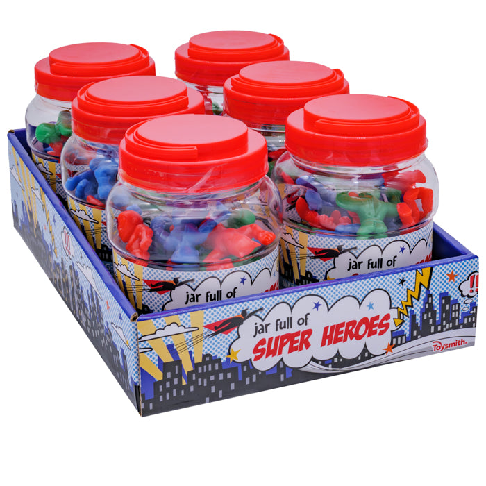 Six plastic jars with red lids, each filled with colorful Toysmith superhero figures, are showcased in a blue comic-themed display box labeled "Toysmith Jar Full of Super Heroes"—ideal for imaginative play and adventures.
