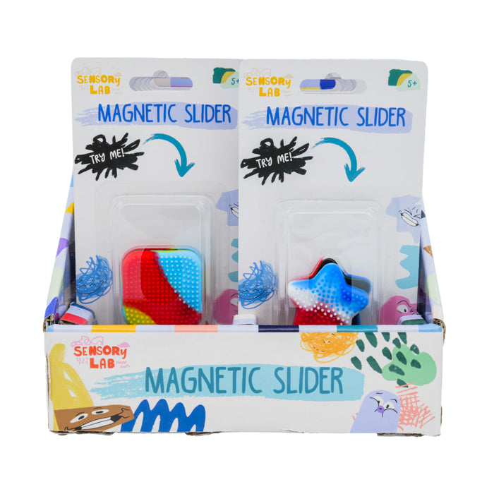 Sensory Lab Magnetic Sliders by Sensory Lab are displayed in colorful boxes with playful graphics and "Try Me!" prompts. Each box contains two vibrant magnetic fidget sliders, encouraging sensory play for ages 5+.