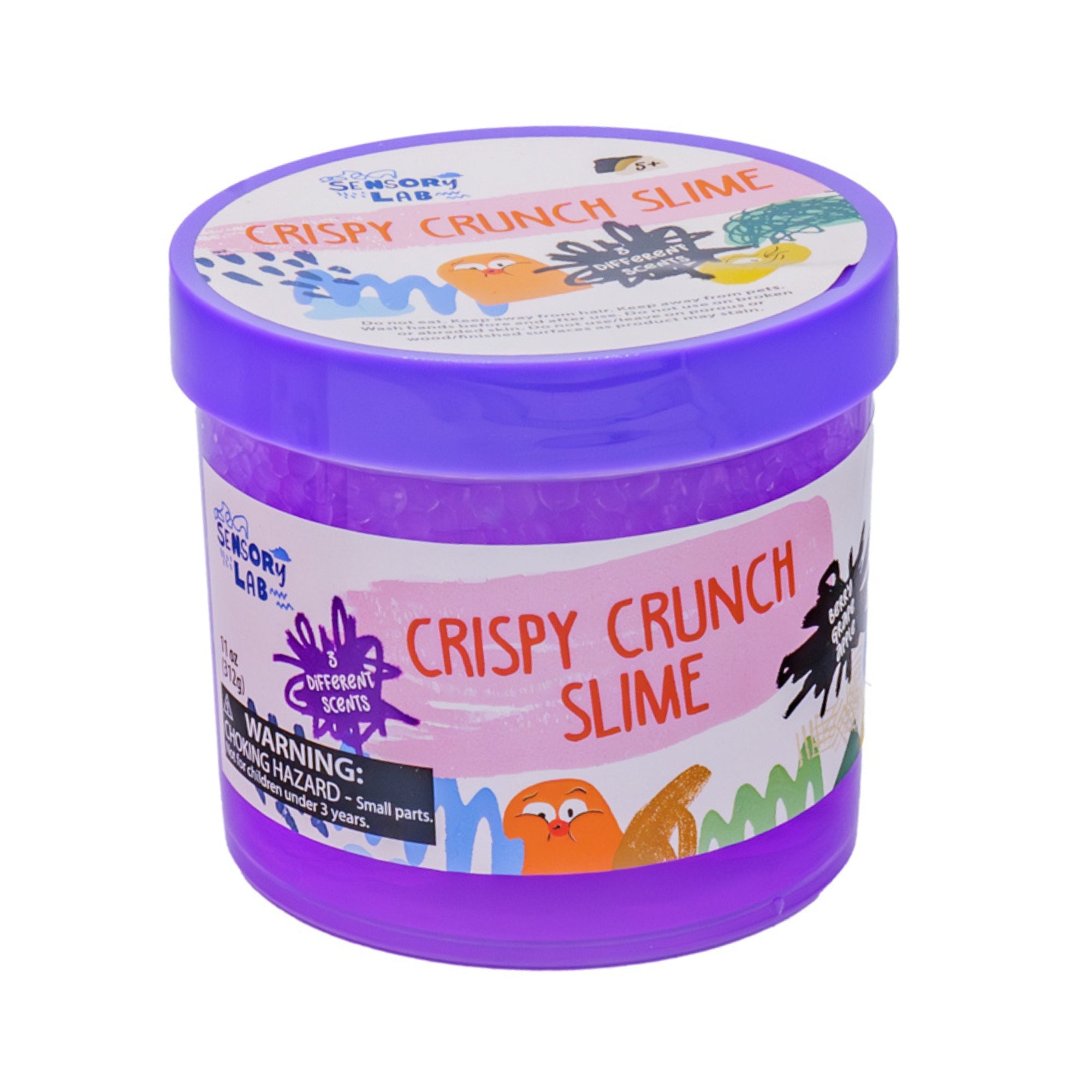 A purple plastic container labeled Sensory Lab Scented Crispy Crunch Slime features colorful graphics, a small parts warning, and a clear window showing crunchy slime inside—ideal for sensory play fans.