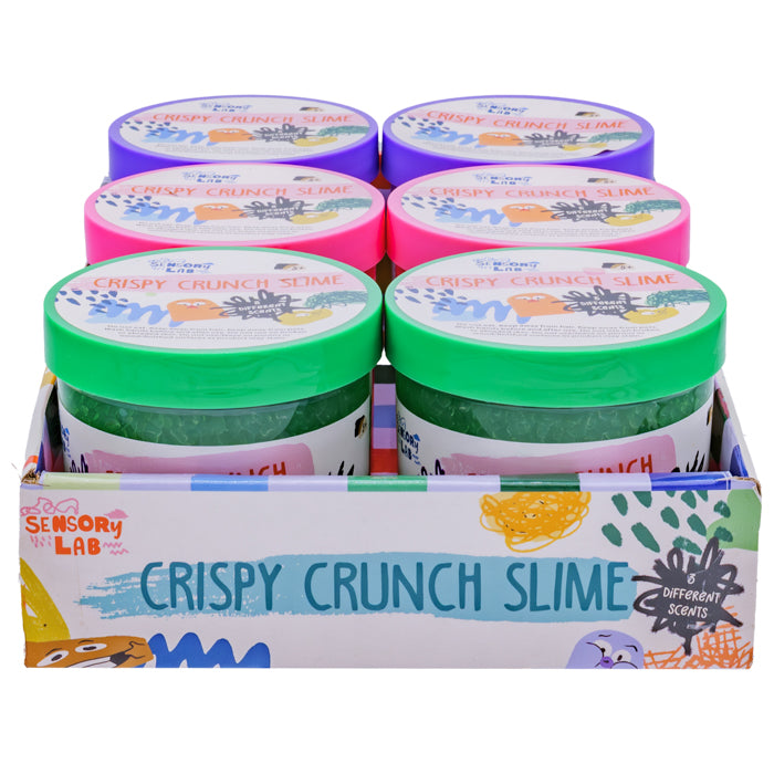 Six tubs of Sensory Lab Scented Crispy Crunch Slimes by Sensory Lab, each with a colorful lid and unique scent, are arranged in a decorative box for a fun, crunchy sensory experience.