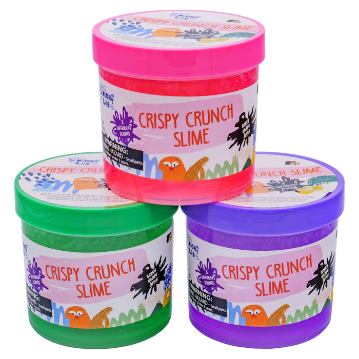 Three Sensory Lab Scented Crispy Crunch Slimes—pink, green, and purple jars topped with playful graphics and warning signs—deliver colorful, textured fun for slime lovers. Each stackable jar features bright labels from Sensory Lab.