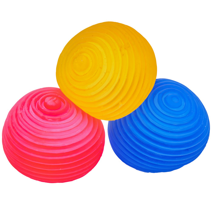 Three Sensory Lab Sugar Skwish Balls by Sugar Skwisheez—yellow, pink, and blue with concentric circle patterns—are arranged in a triangular cluster on a white background, perfect for sensory play or fidgeting.