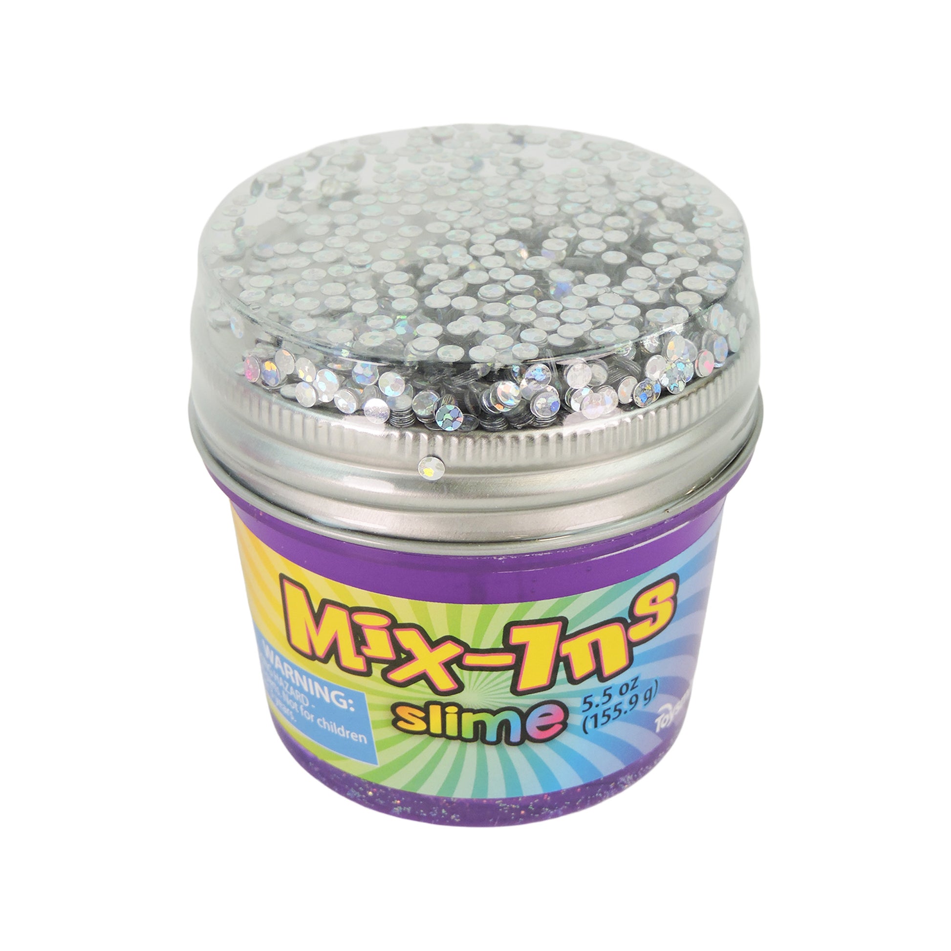 The Toysmith Mix-In Slime is a small container with a purple base and silver lid, packed with shiny silver sequins. The colorful label warns it's not suitable for children under 3 years. Brand: Toysmith.