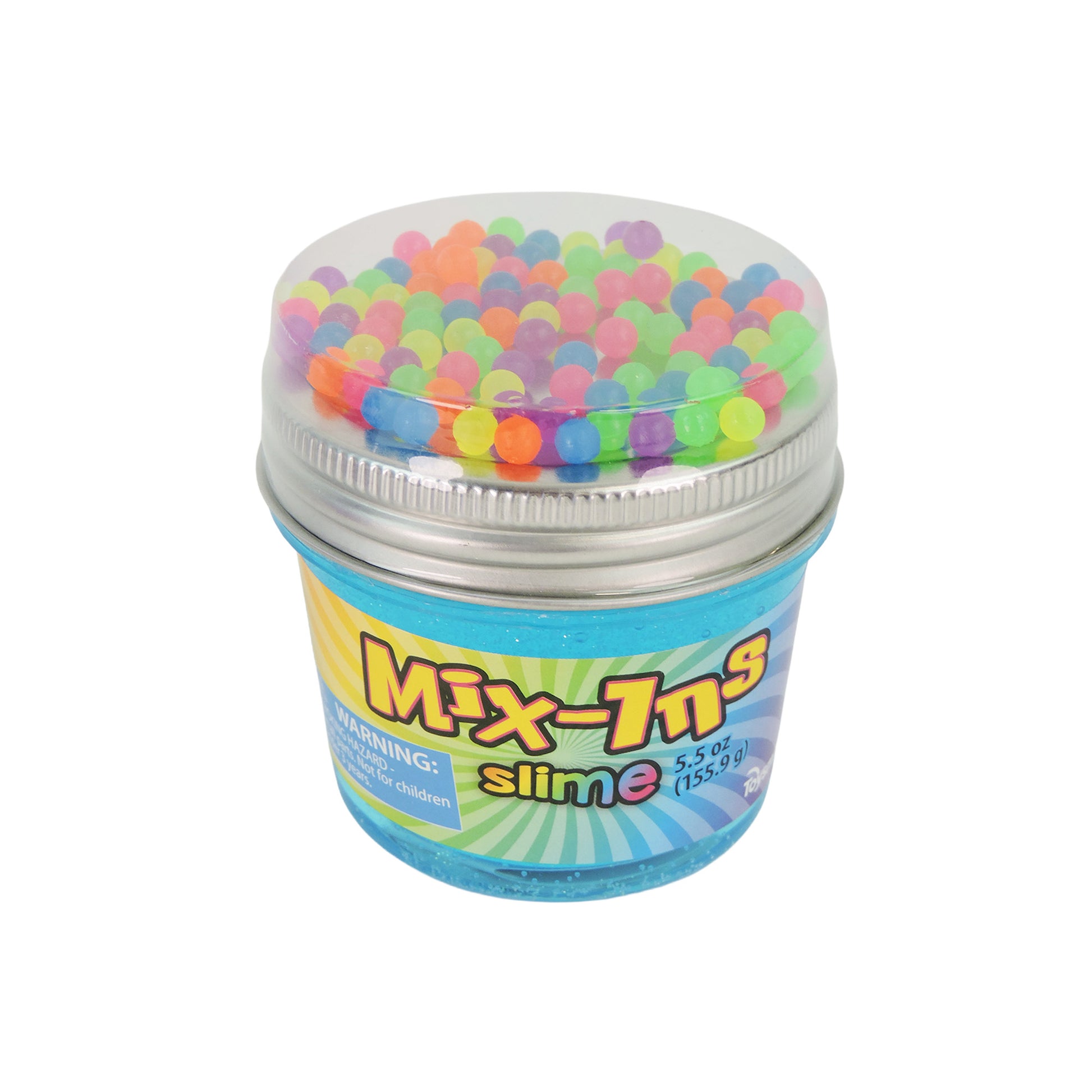 A clear plastic jar labeled Toysmith Mix-In Slime by Toysmith contains blue slime and colorful foam beads, visible under the silver lid. The jar features a vibrant label.