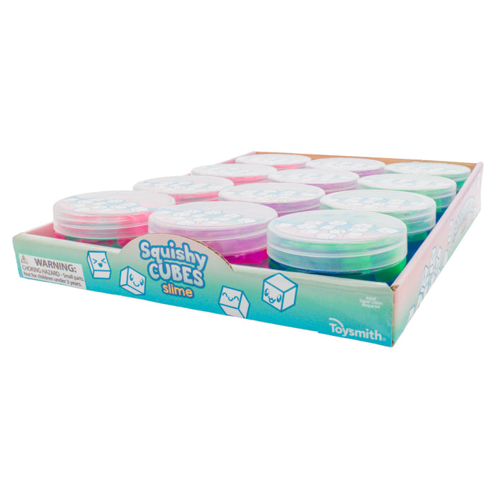 A display box of Toysmith Squishy Cube Slime features sensory toys in assorted colors, each with a clear lid, neatly arranged in rows against a white background.