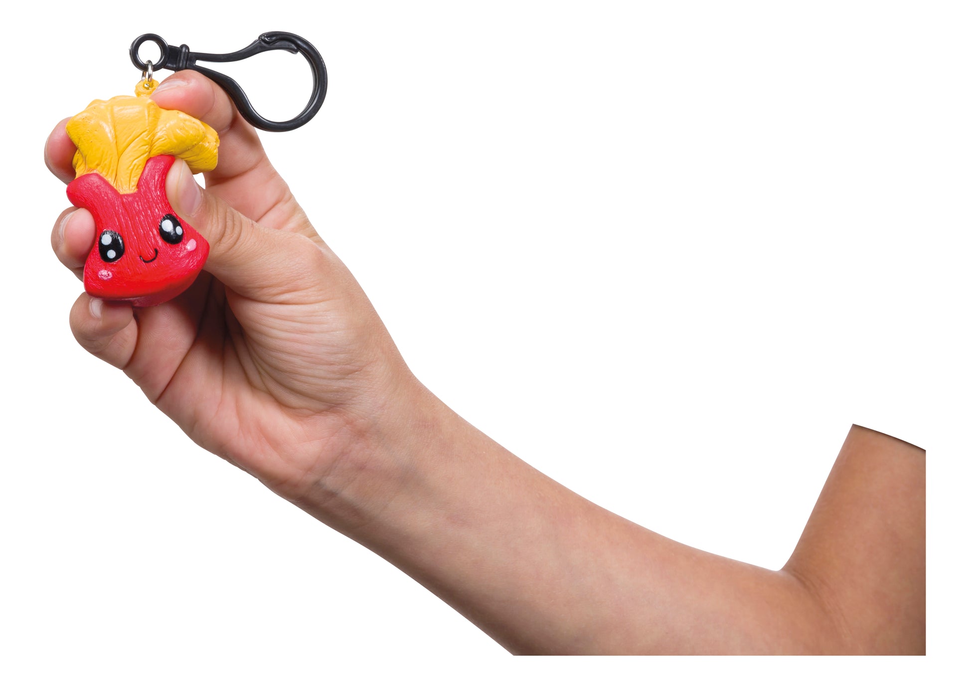 A hand holds the Oddly Satisfying Surprise N' Slime Mystery Ball keychain featuring a cute red character with big eyes and yellow leaves on its head, set against a white background.