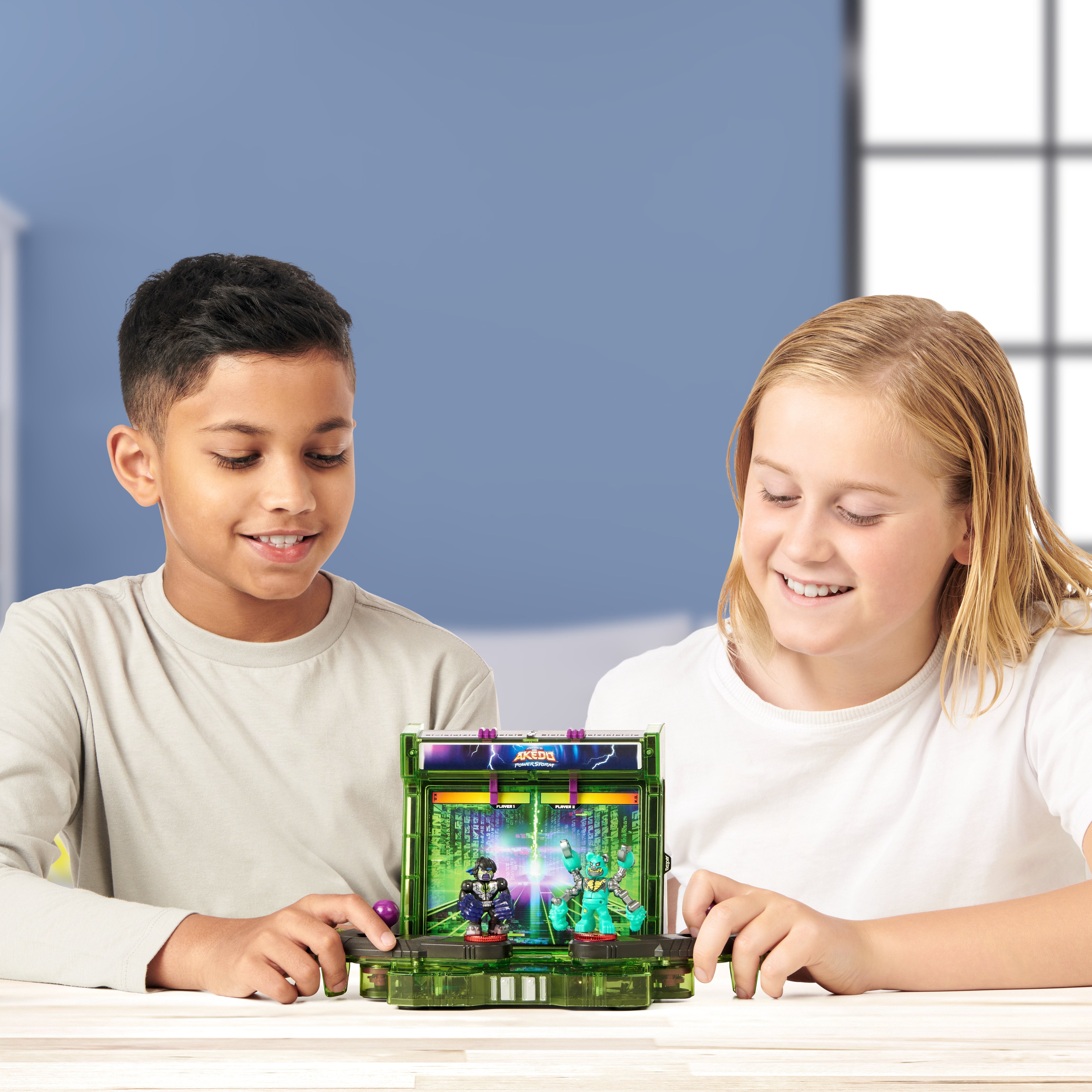 Two children playing with a handheld gaming device on a table.