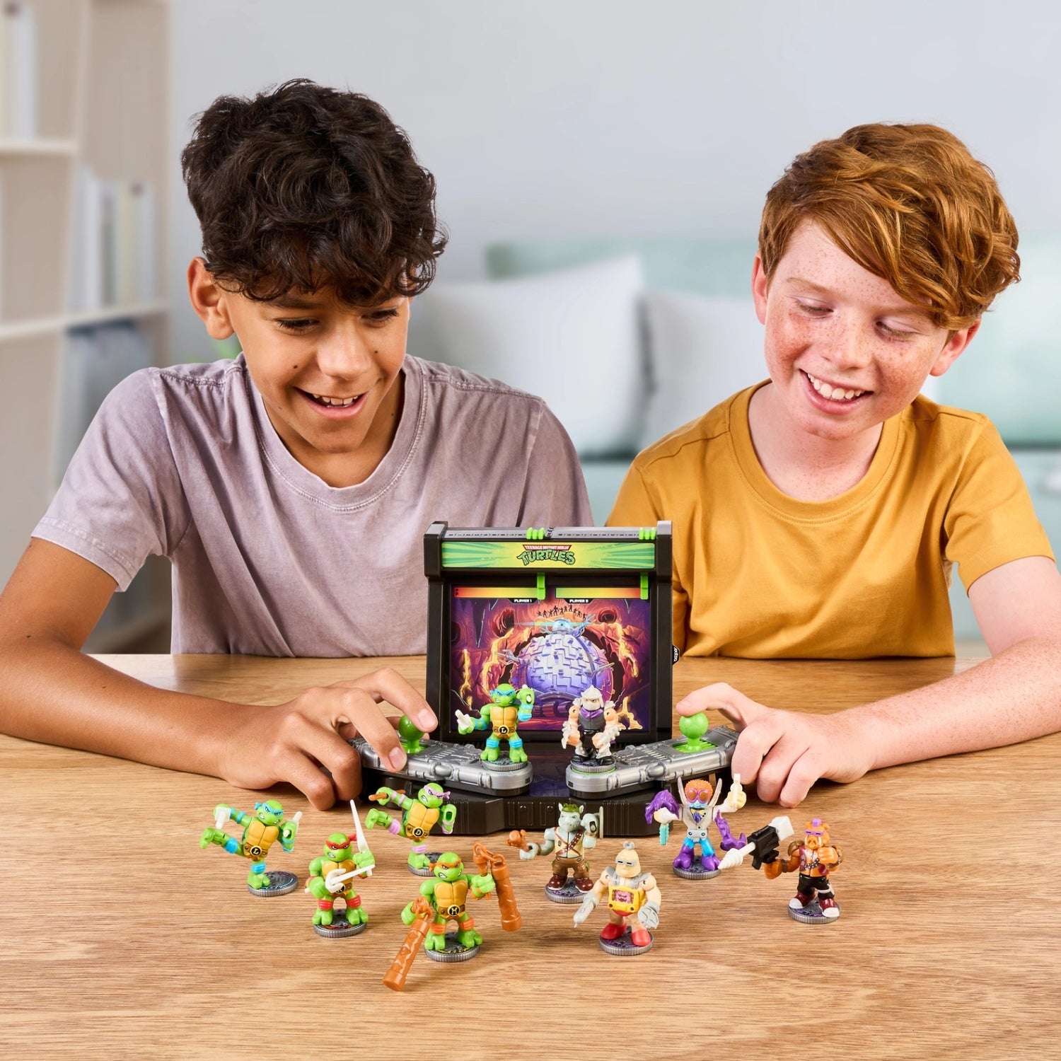 Two children playing with toy figures on a table
