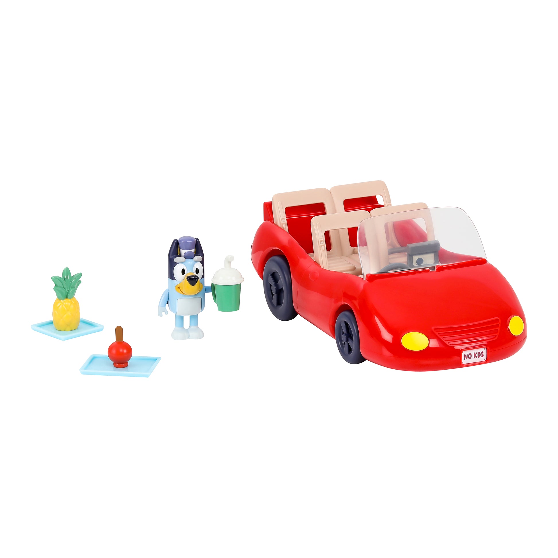 Toy red car with figures on a white background