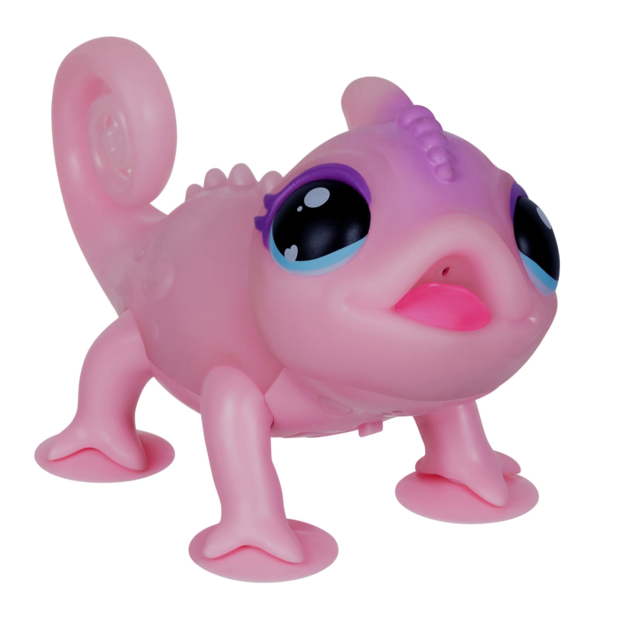 The Moose Toys Little Live Pets S2 Lil' Chameleon is a pink, cartoon-style interactive pet with big blue eyes, a curled tail, and playful expression—perfect for endless color-changing fun.
