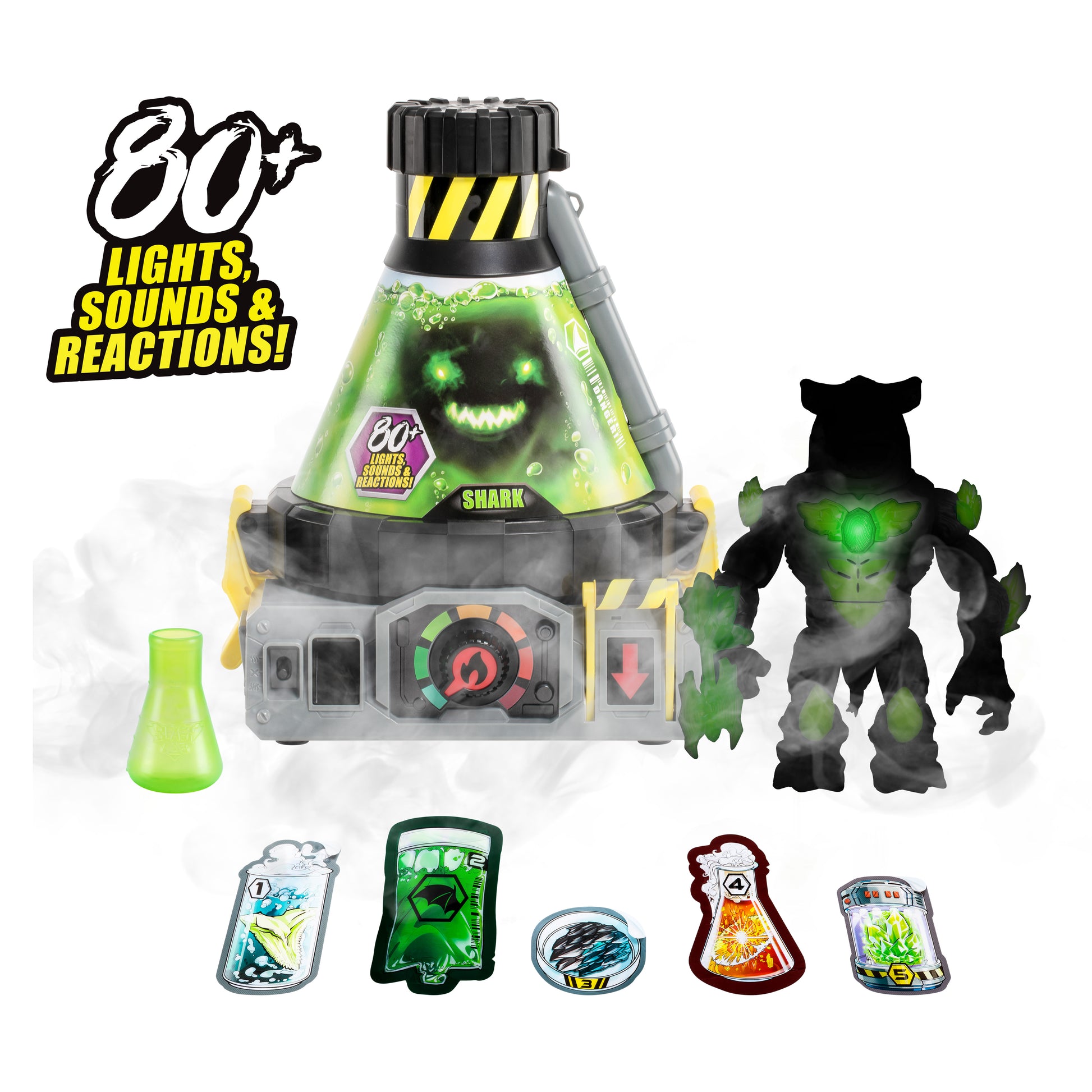 Toy set with a central device labeled 'Shark' featuring lights, sounds, and reactions, surrounded by figures and accessories on a white background.