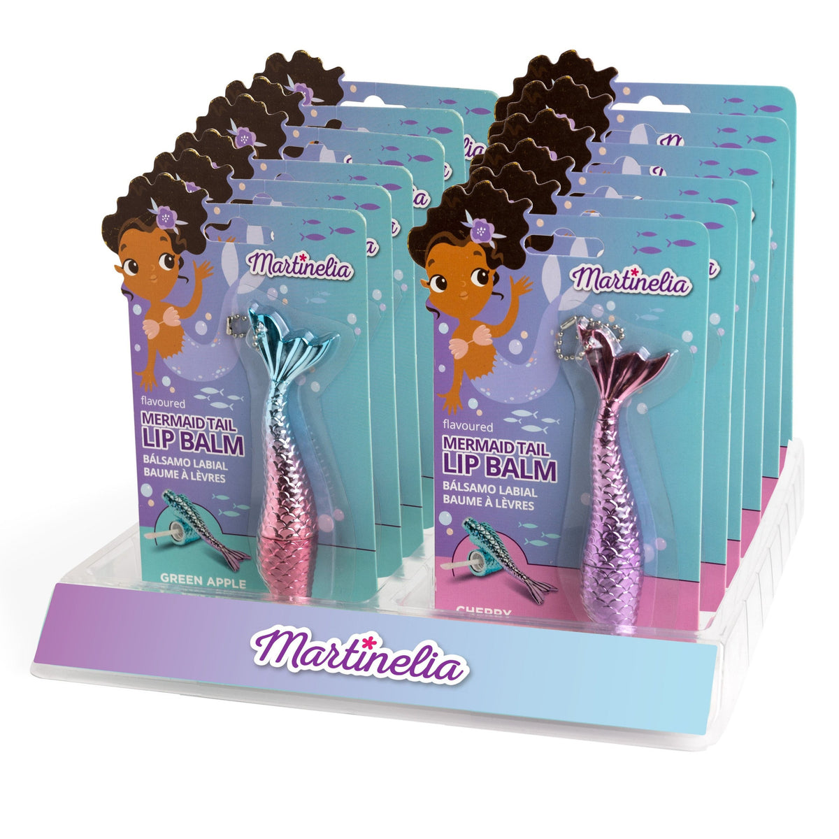 Martinelia Mermaid Tail Lip Gloss display features green apple and cherry flavors, with metallic pink and blue mermaid tail-shaped tubes and a cartoon girl on the packaging—all arranged on a branded stand for fruity lip gloss fans.