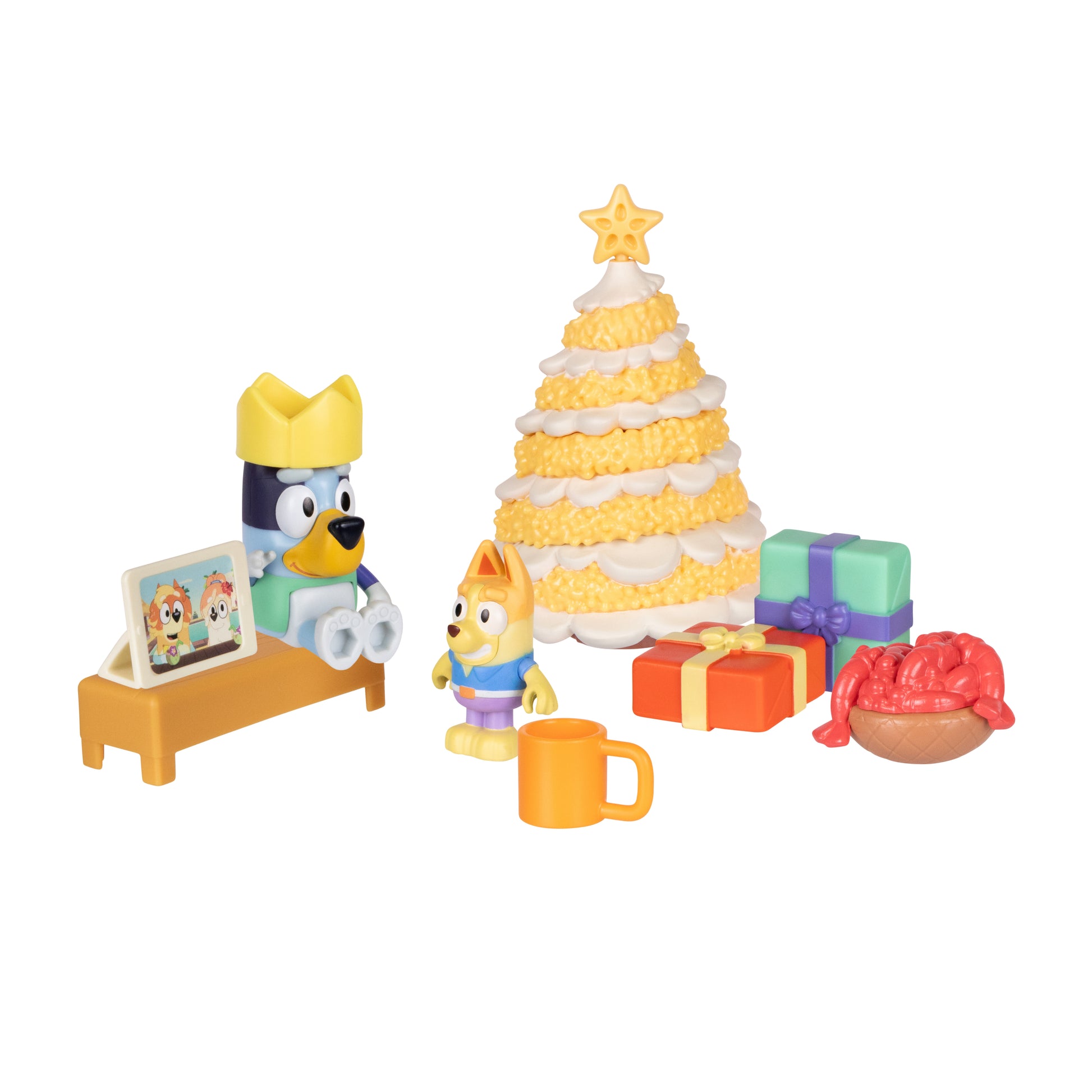 Toy set with a Christmas tree, presents, and characters on a white background