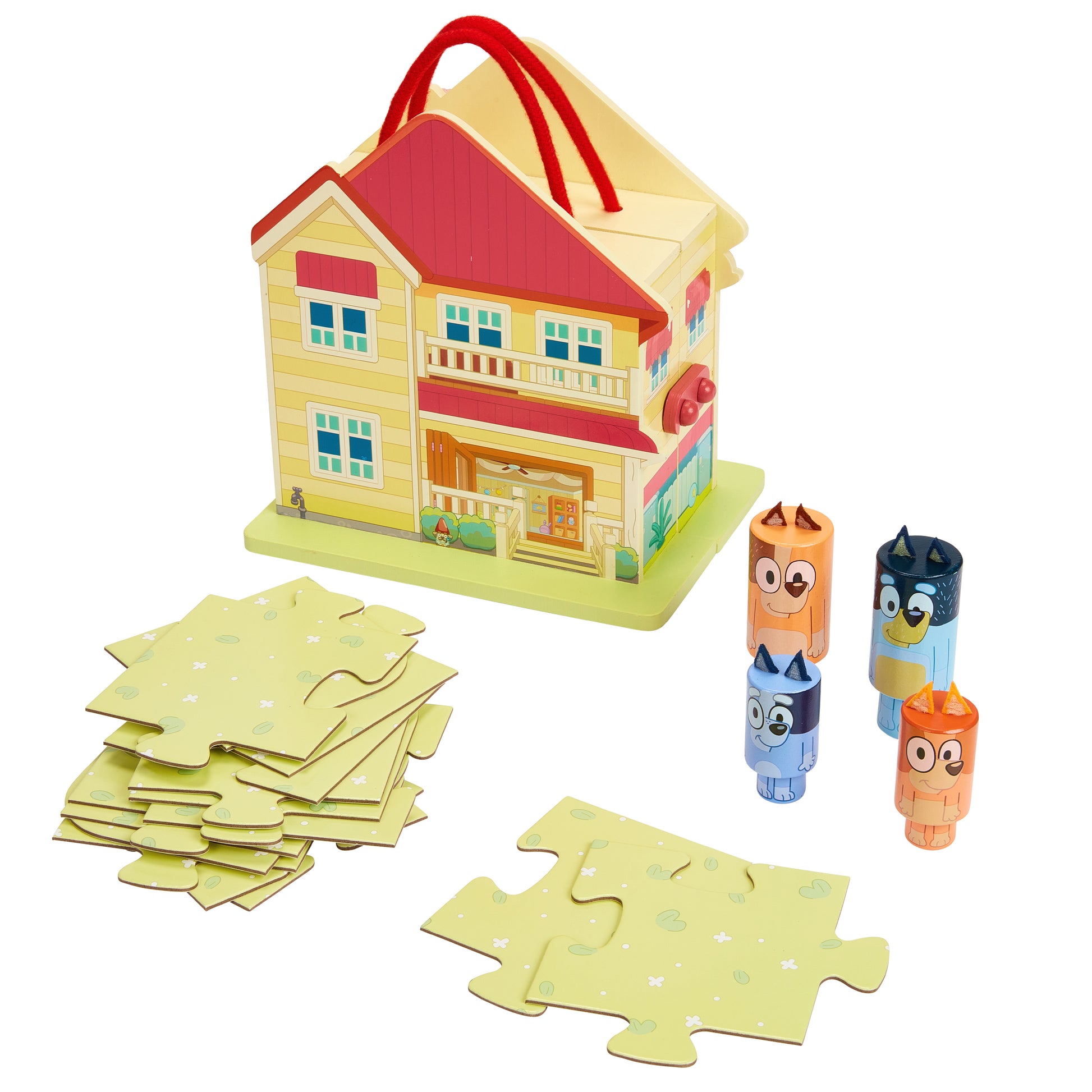 Toy house with puzzle pieces and character figures on a white background