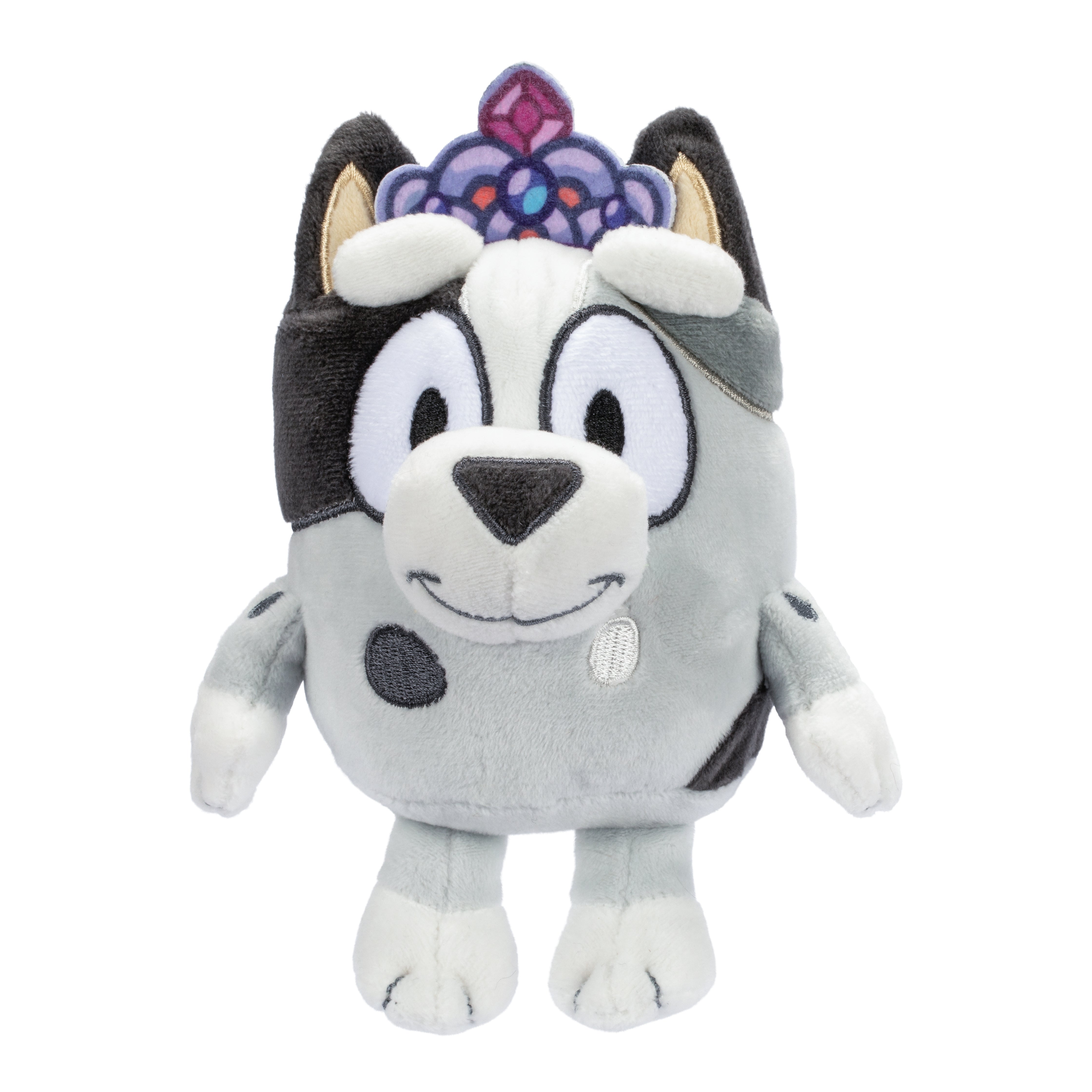 The Moose Toys Bluey S11 Friends Plush is a plush toy dog with gray and white fur, black spots, a smiling face, and a purple jeweled crown on its head.