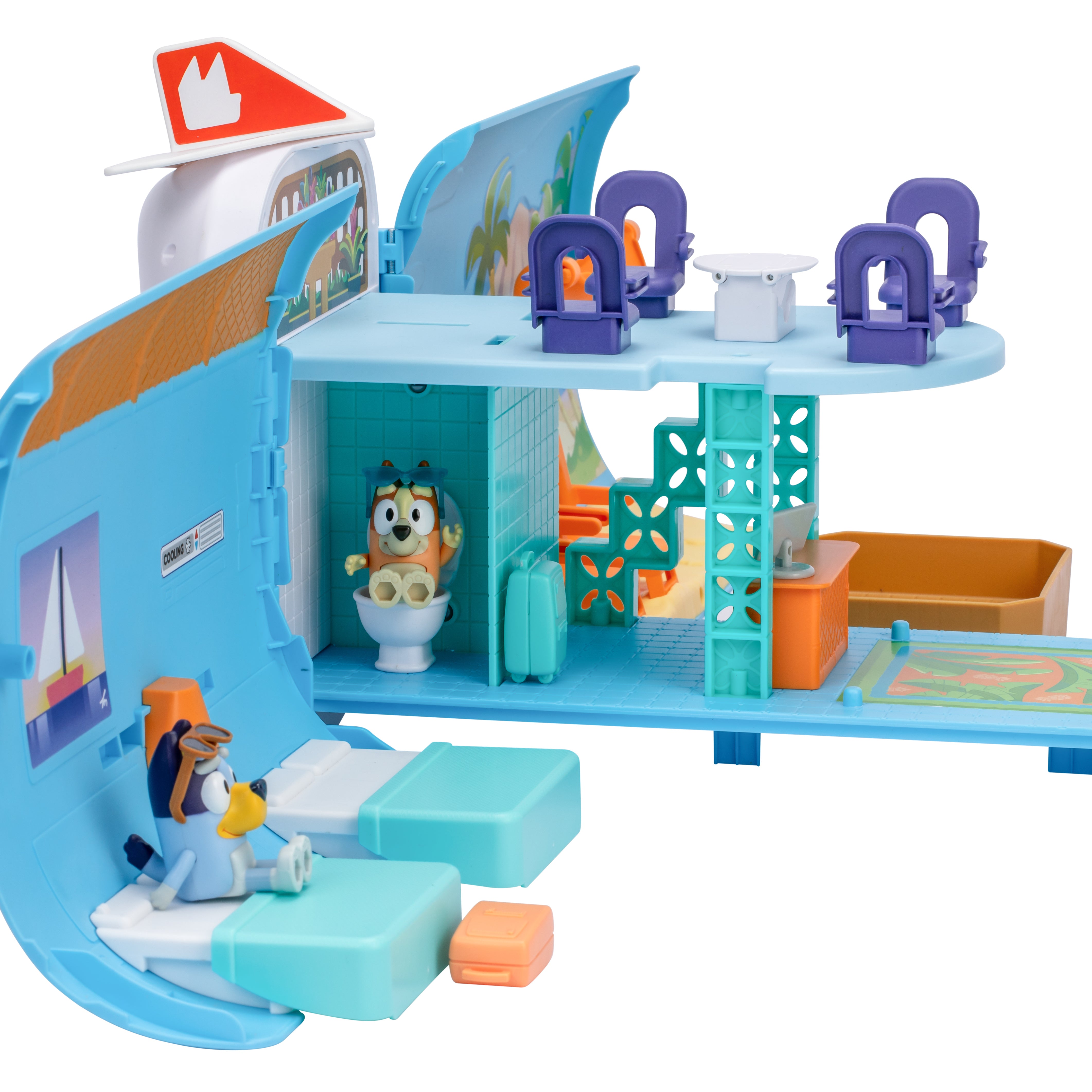 Toy cruise ship with various rooms and characters on a white background