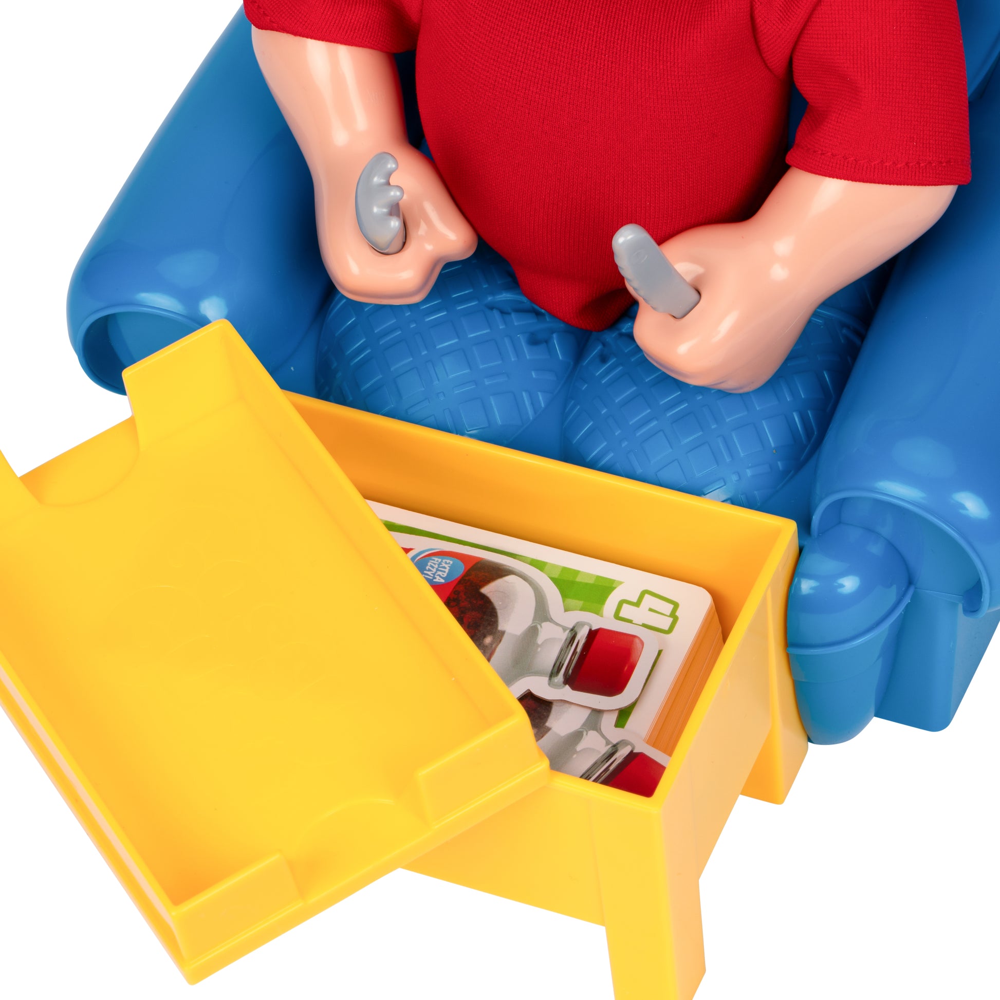 Toy figure with a red shirt and blue pants sitting on a yellow toy car with open doors.