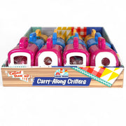 The Farm Fresh Carry-Along Critters display box features five colorful animal carriers by Farm Fresh, each with a handle and circular windows, in pink and blue—ideal for storing mini pet figurines or collectible toys.