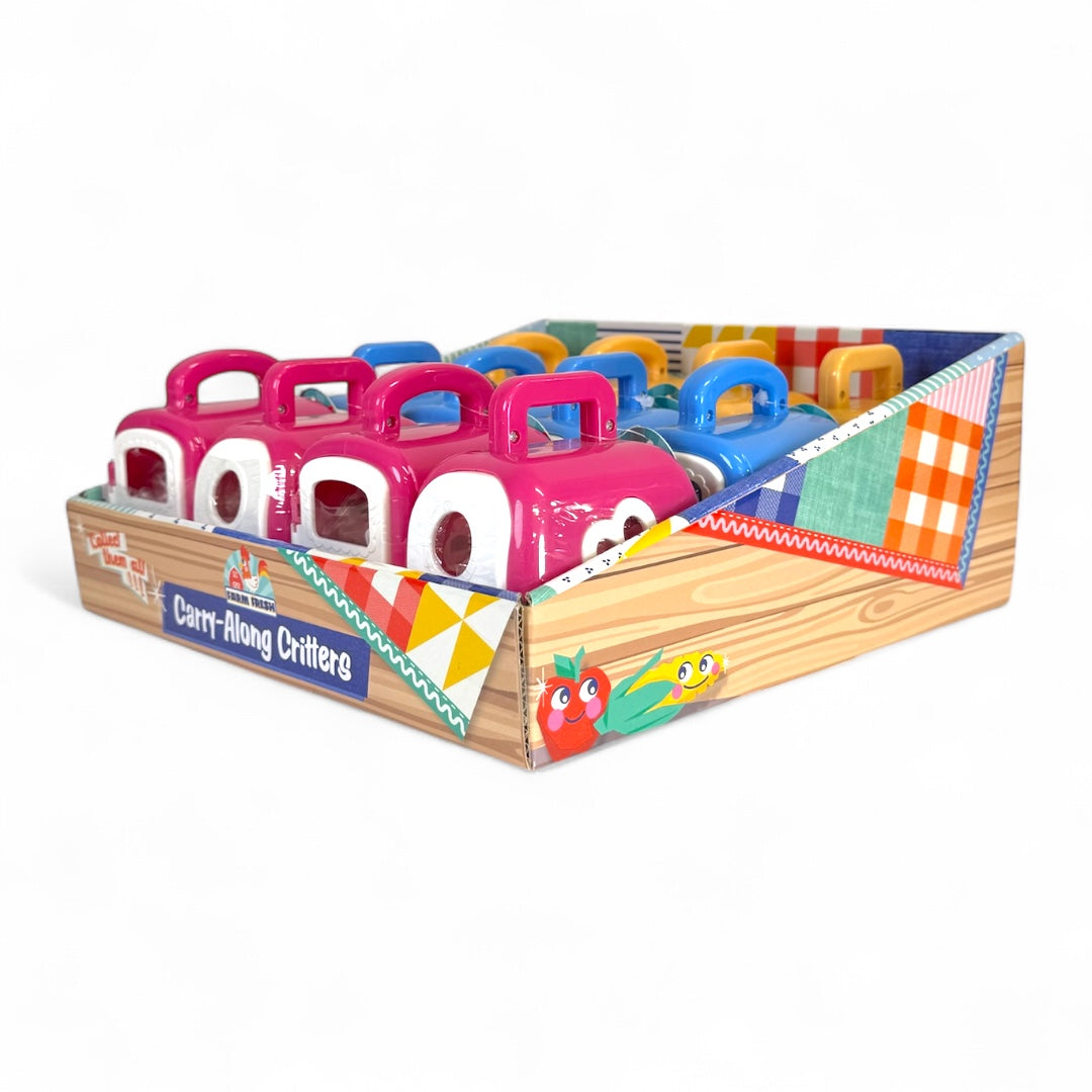 The Farm Fresh Carry-Along Critters display box from Farm Fresh features colorful mini pet figurines with handles in pink, red, blue, and yellow, all neatly arranged on a patterned cardboard base.