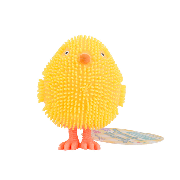 The Toysmith Light-Up Squishies is a yellow, round, spiky rubber chick toy with orange beak and feet, small wings, and two eyes—perfect for sensory play. A tag is attached as it stands on a white surface. Brand: Toysmith.