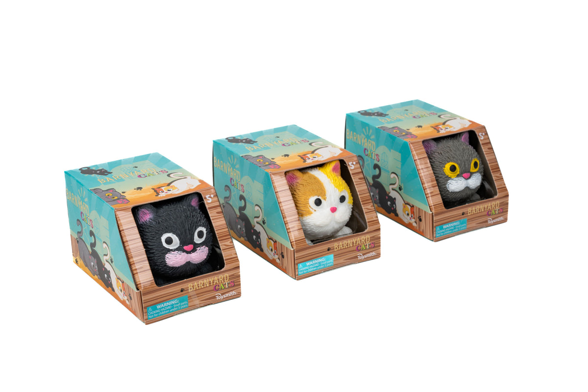 Three Farm Fresh Barnyard Cats plush toys are displayed in crate-style boxes: one black with pink details, one orange and white, and one black with yellow eyes.