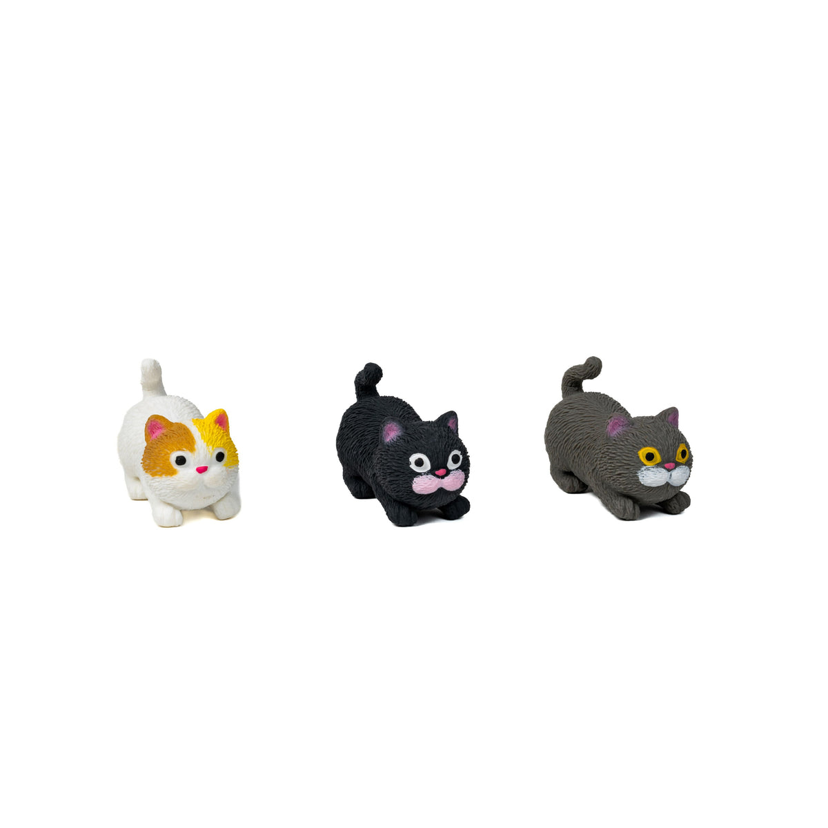The Farm Fresh Barnyard Cats set features three small cat figures in playful poses—white with orange spots, black with pink details, and gray with yellow eyes—ideal for imaginative play on a white background.
