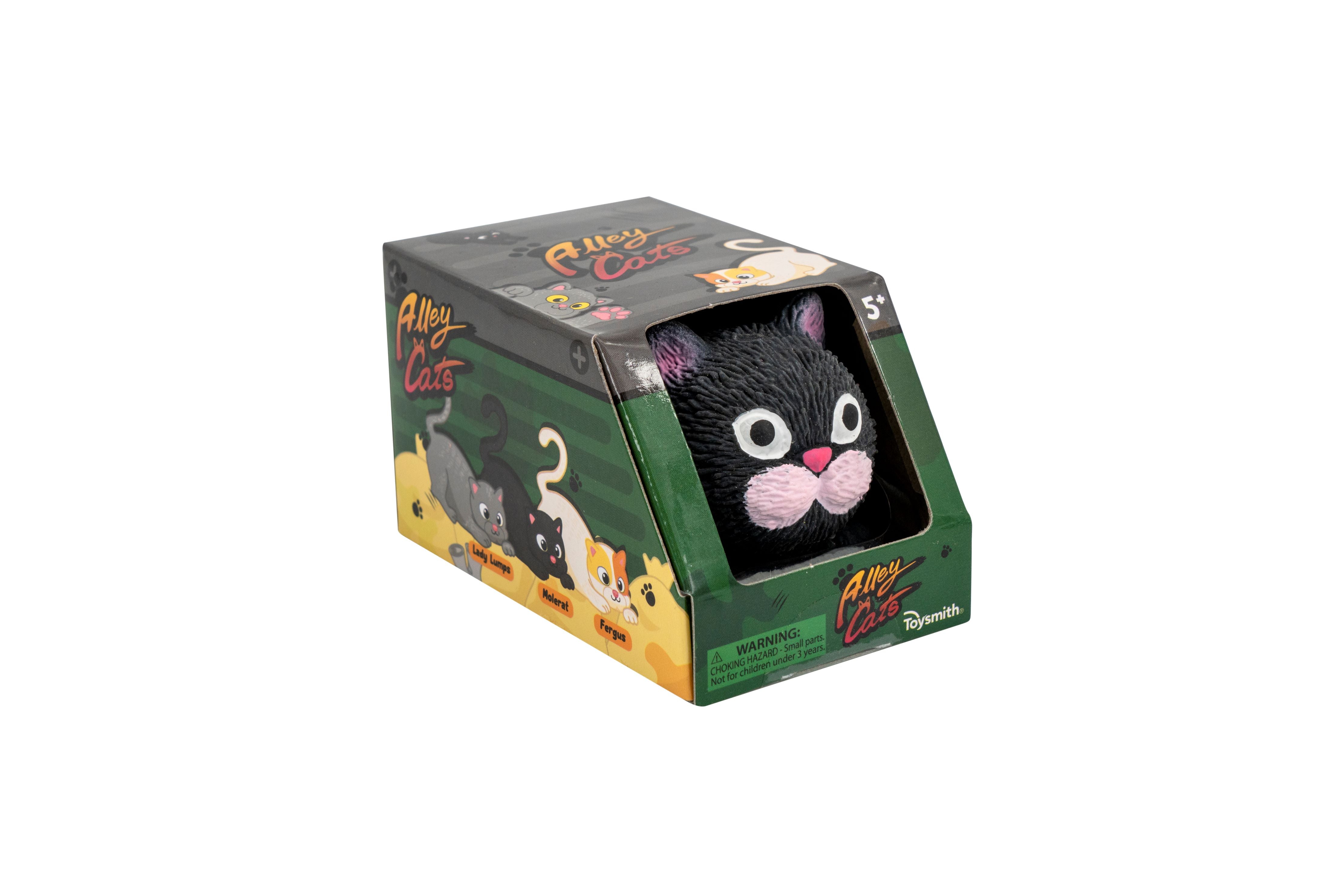 A boxed toy labeled Alley Cats features a black cat head with large eyes and pink nose peeking out of the packaging. The box displays illustrations of various cartoon cats and is marked for ages 5 and up.
