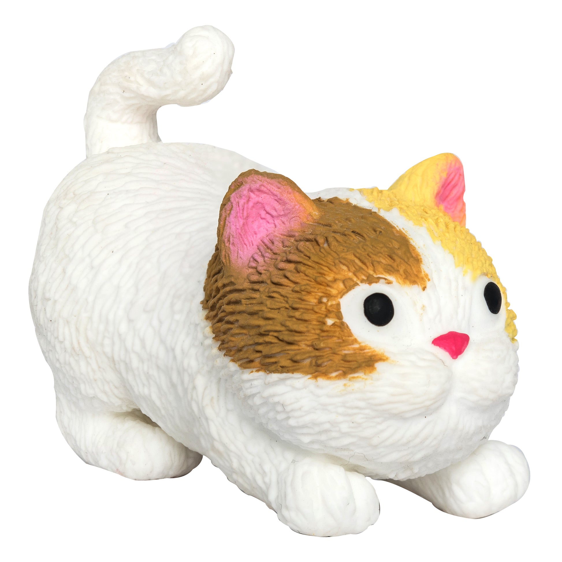 A small, round, toy cat figurine with a white body, brown and yellow markings on its head, pink ears, a pink nose, and a curled tail. The figurine has large black eyes and a playful crouching pose.