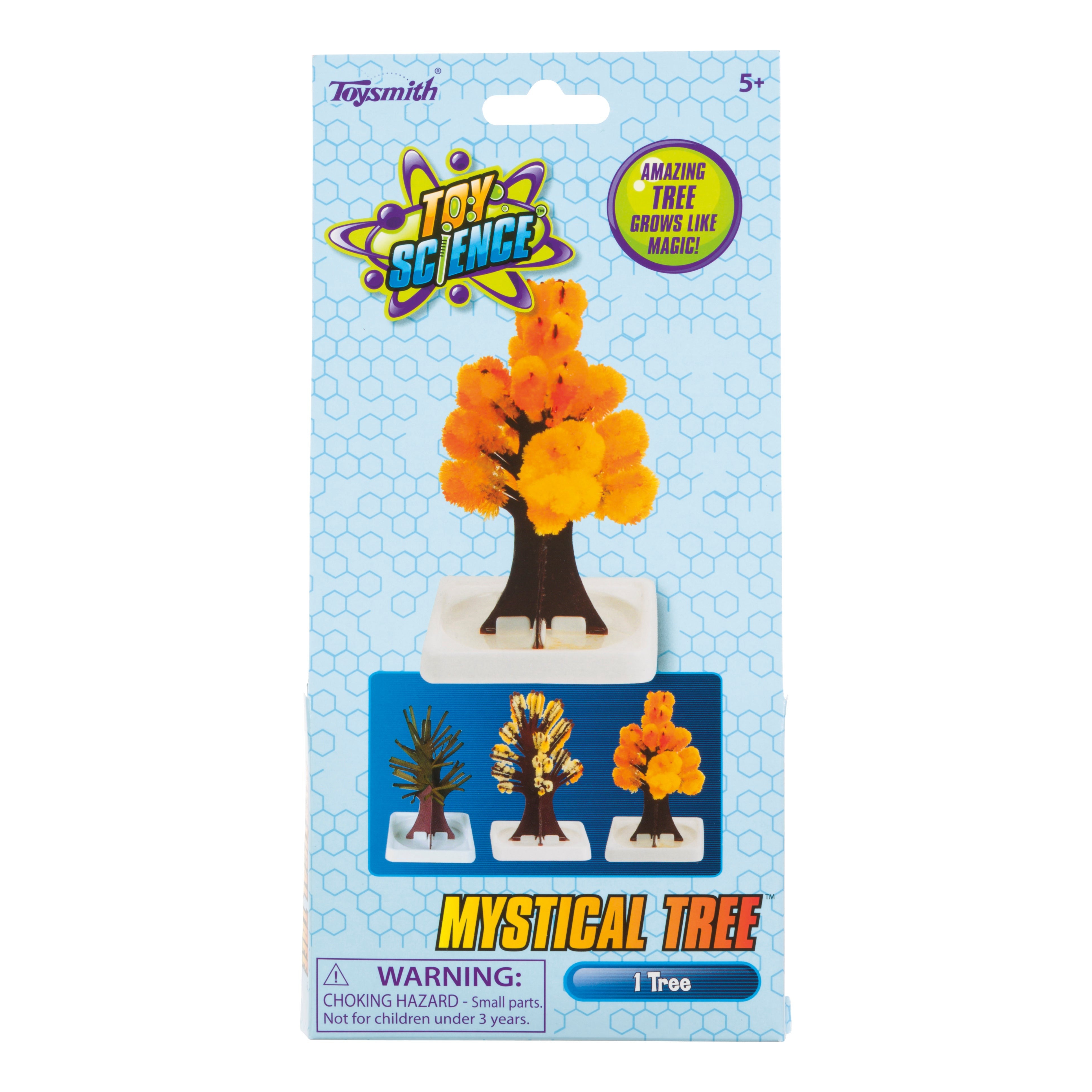 The Toy Science Mystical Tree kit by Toy Science features packaging with a small crystal tree with bright orange foliage on a white base and images of its growth stages. Packaging includes a warning about small parts.