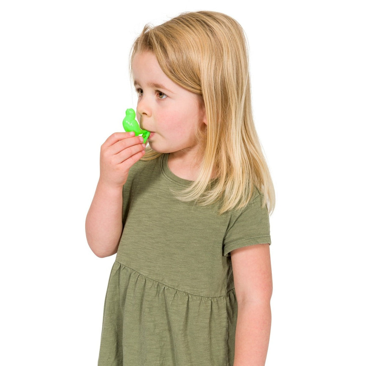 A young girl in a green dress holds the Neato! Bird Whistle by Neato! to her mouth, ready for interactive fun with this charming sound toy against a plain white background.
